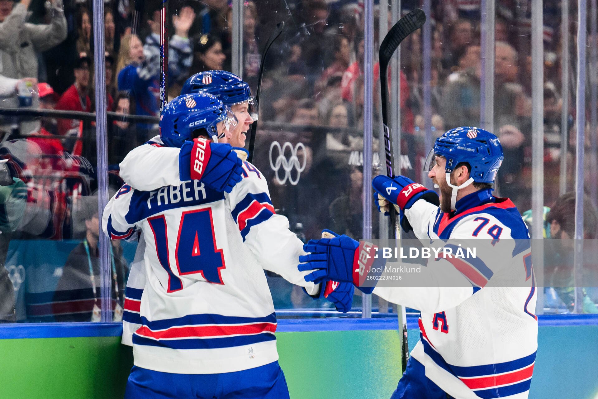 Matt Boldy, Brock Faber and Jaccob Slavin of USA celebrate