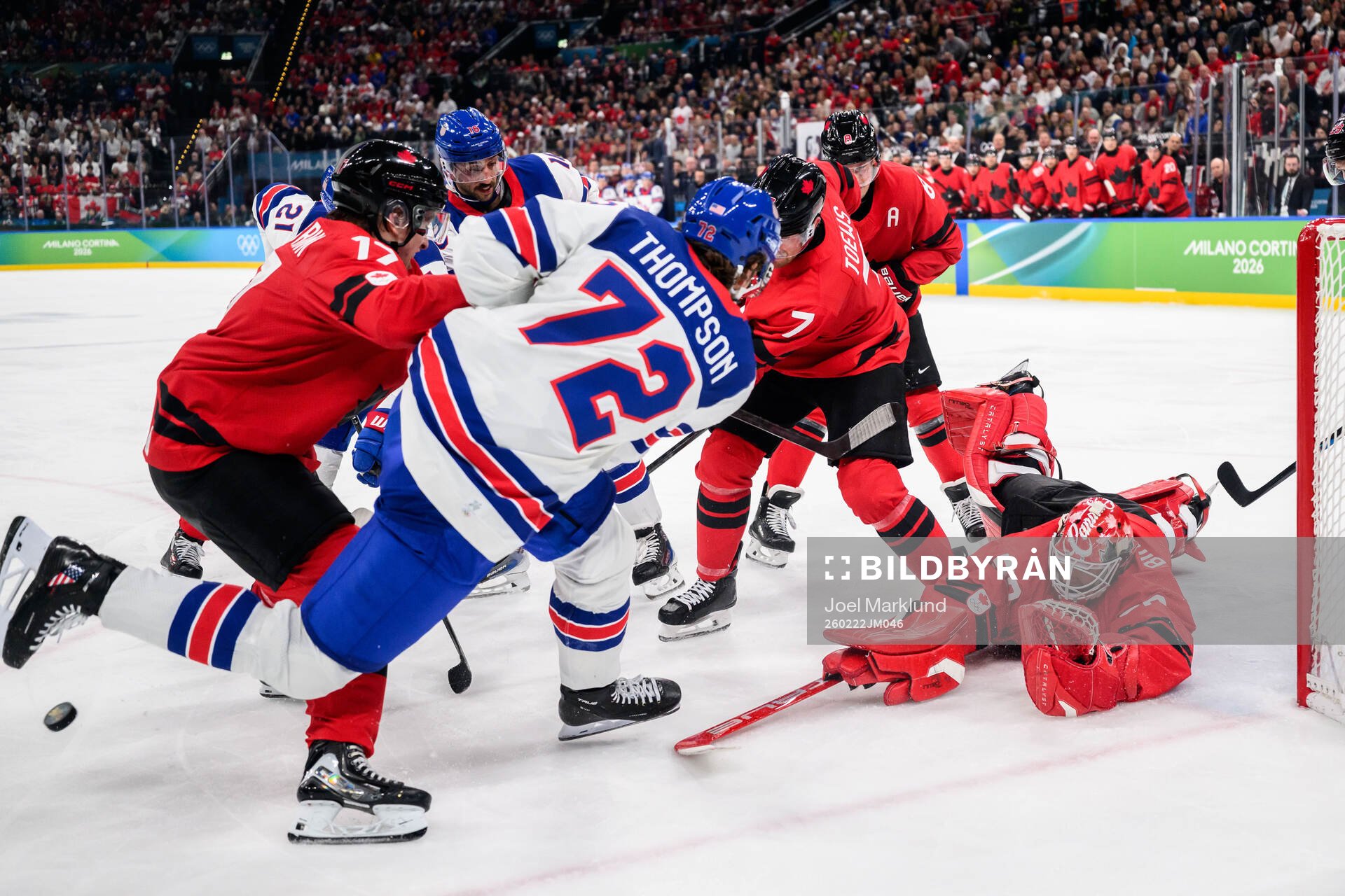 Tage Thompson of USA against Macklin Celebrini, Devon Toews