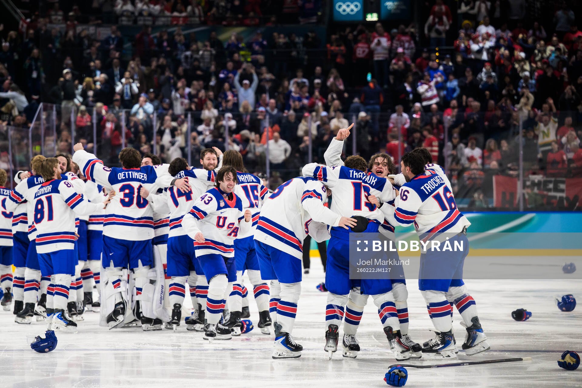 Jack Hughes of USA celebrates with teammates the