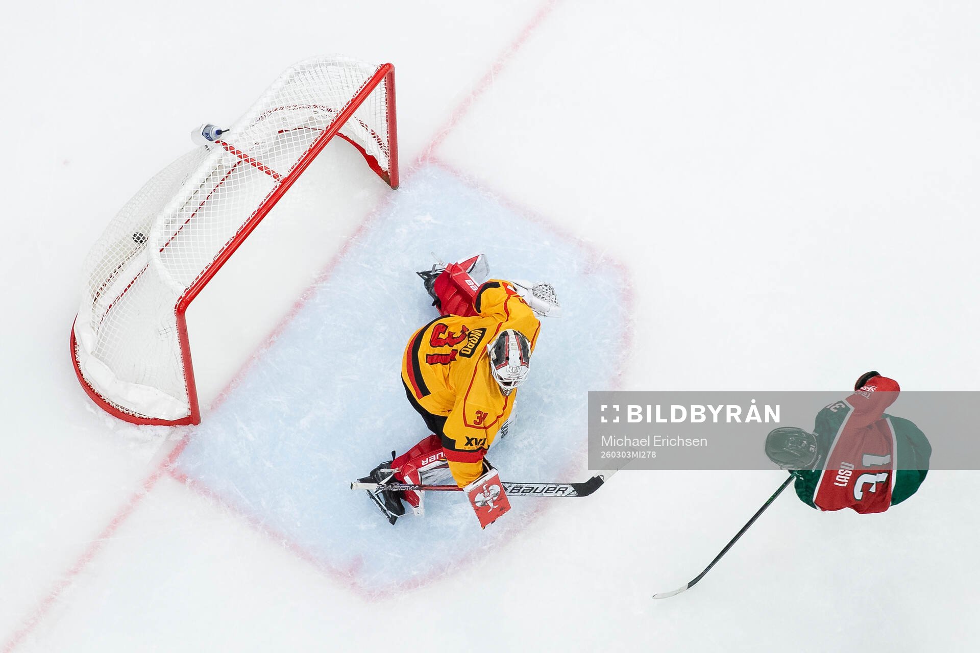 Nicklas Lasu of Frölunda scores 1-0 behind goaltender