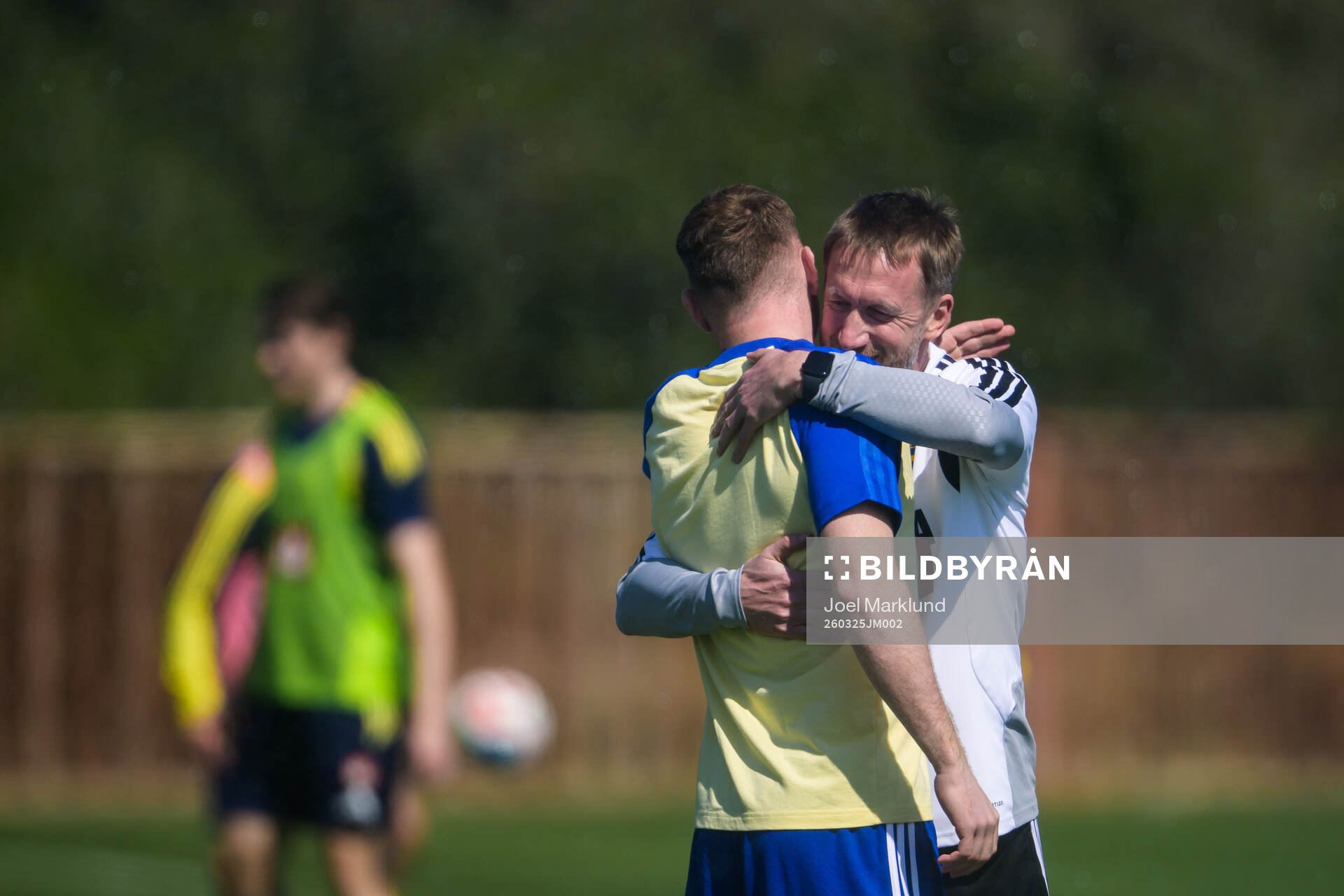 Injured player Dejan Kulusevski gets a hug from head coach