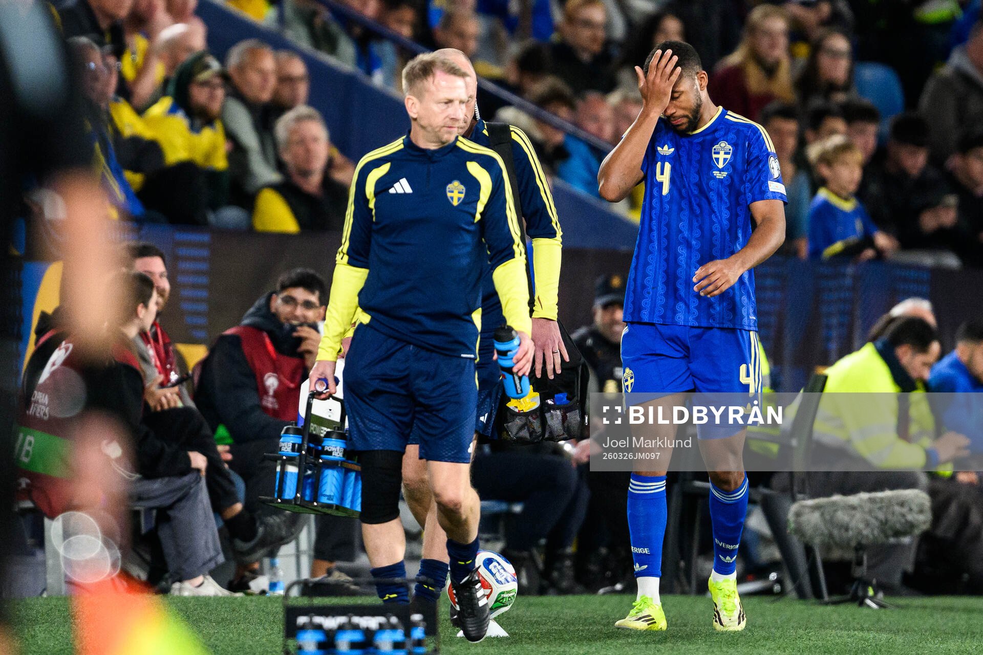 Isak Hien of Sweden leaves the pitch with an injury