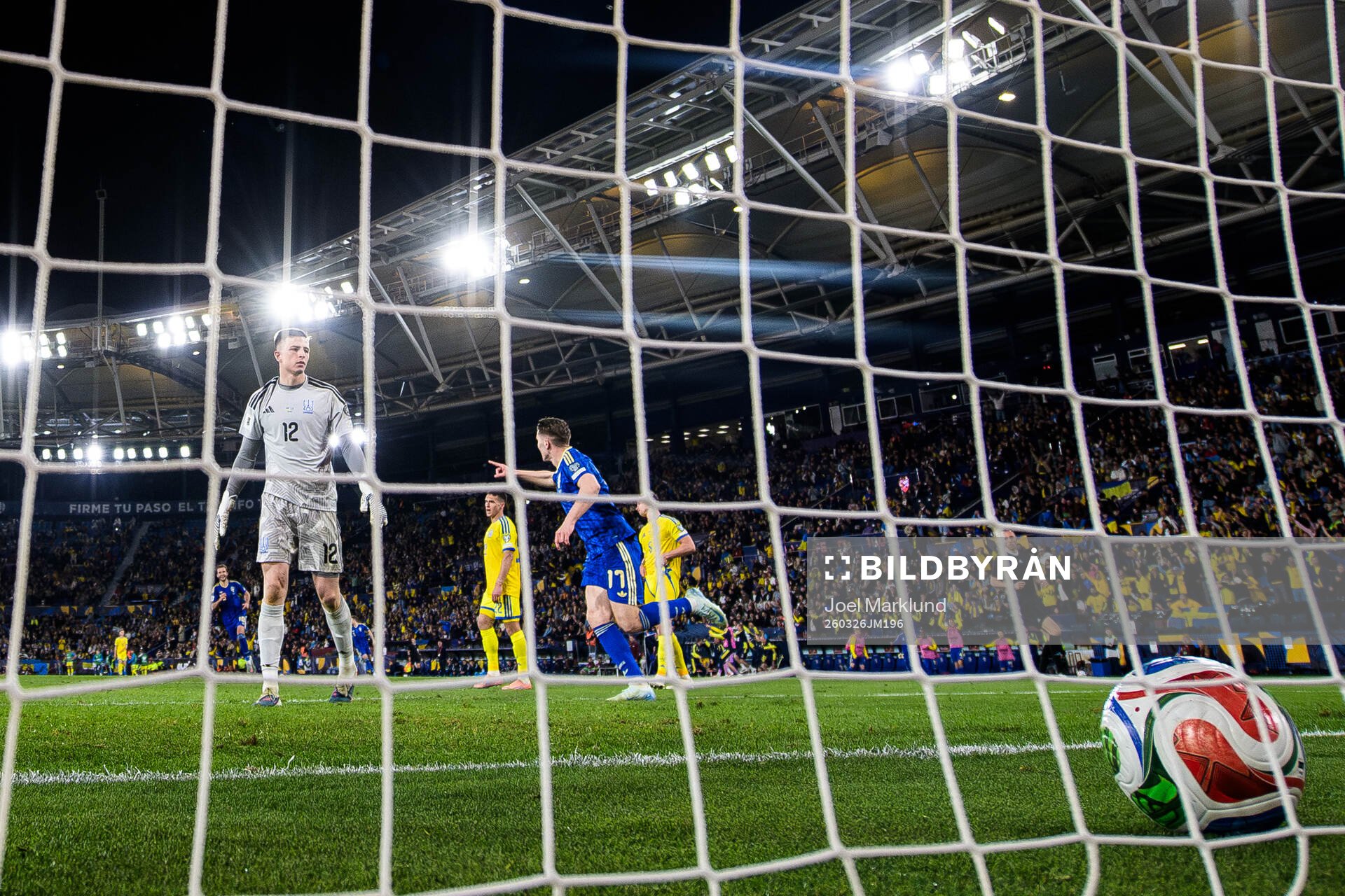 Goalkeeper Anatoliy Trubin of Ukraine looks dejected when