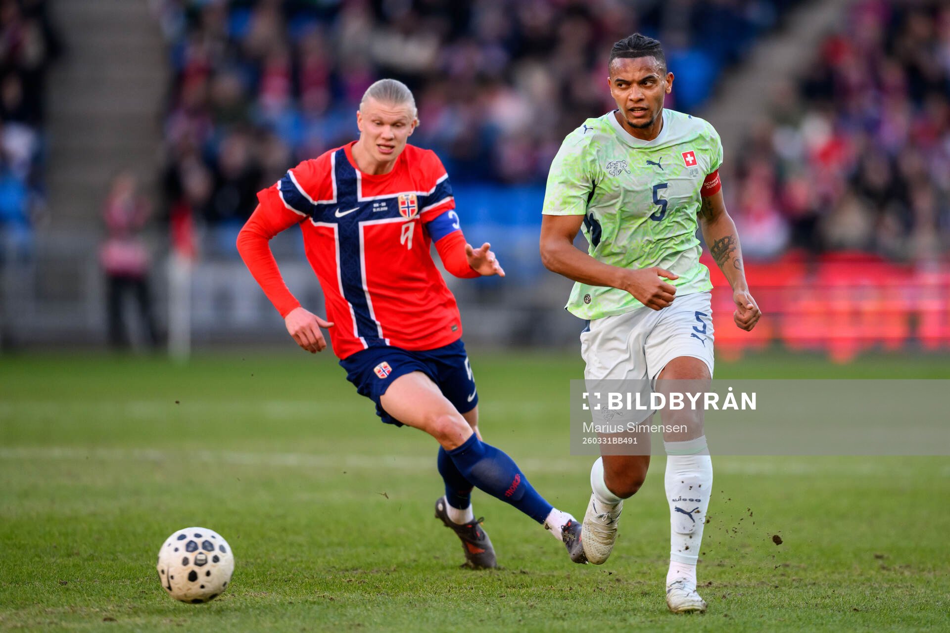 Erling Braut Haaland of Norway and Manuel Akanji of
