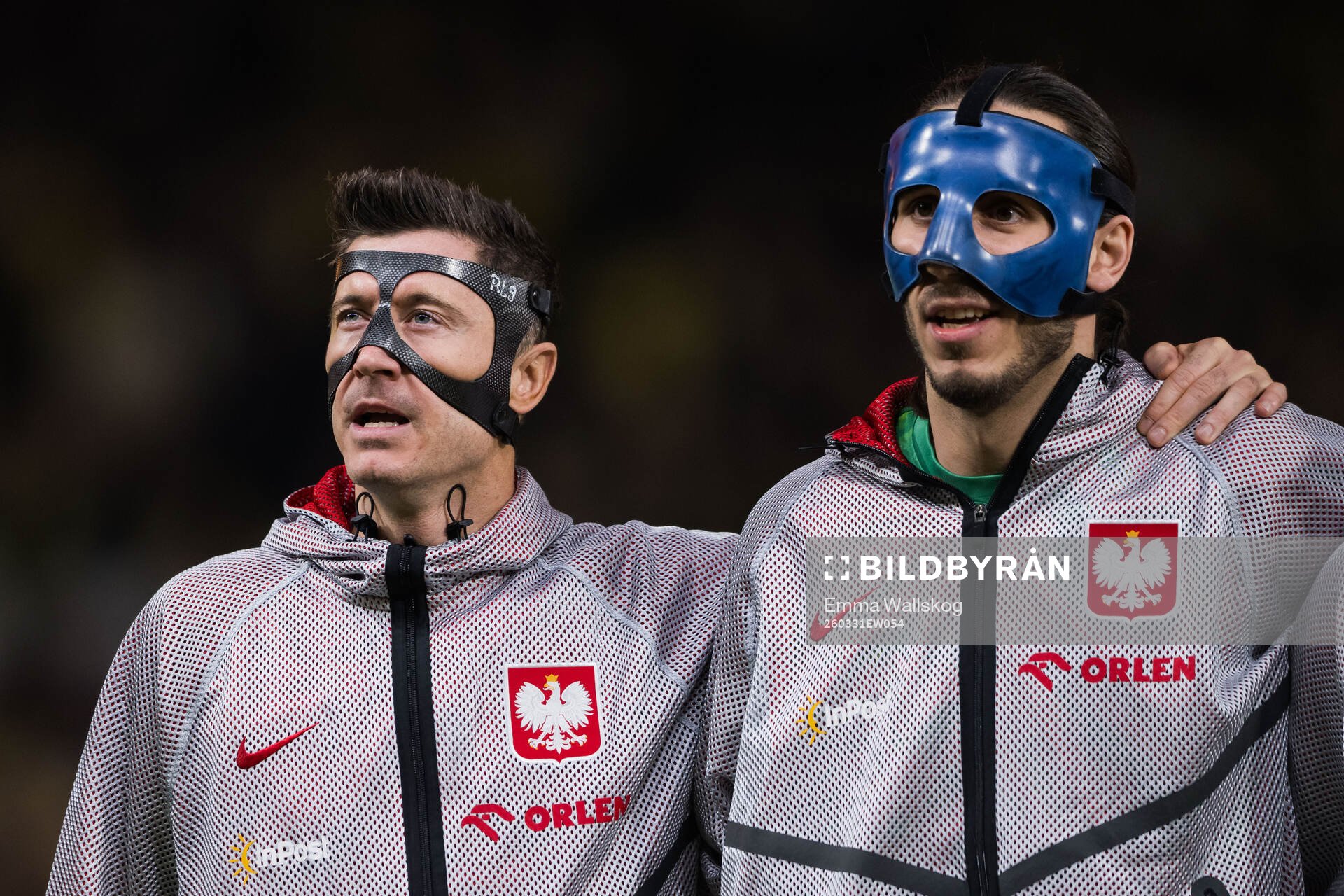 Robert Lewandowski and goalkeeper Kamil Grabara of Poland