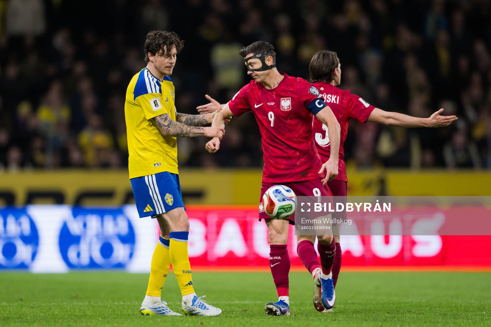 Victor Nilsson Lindelöf of Sweden and Robert Lewandowski