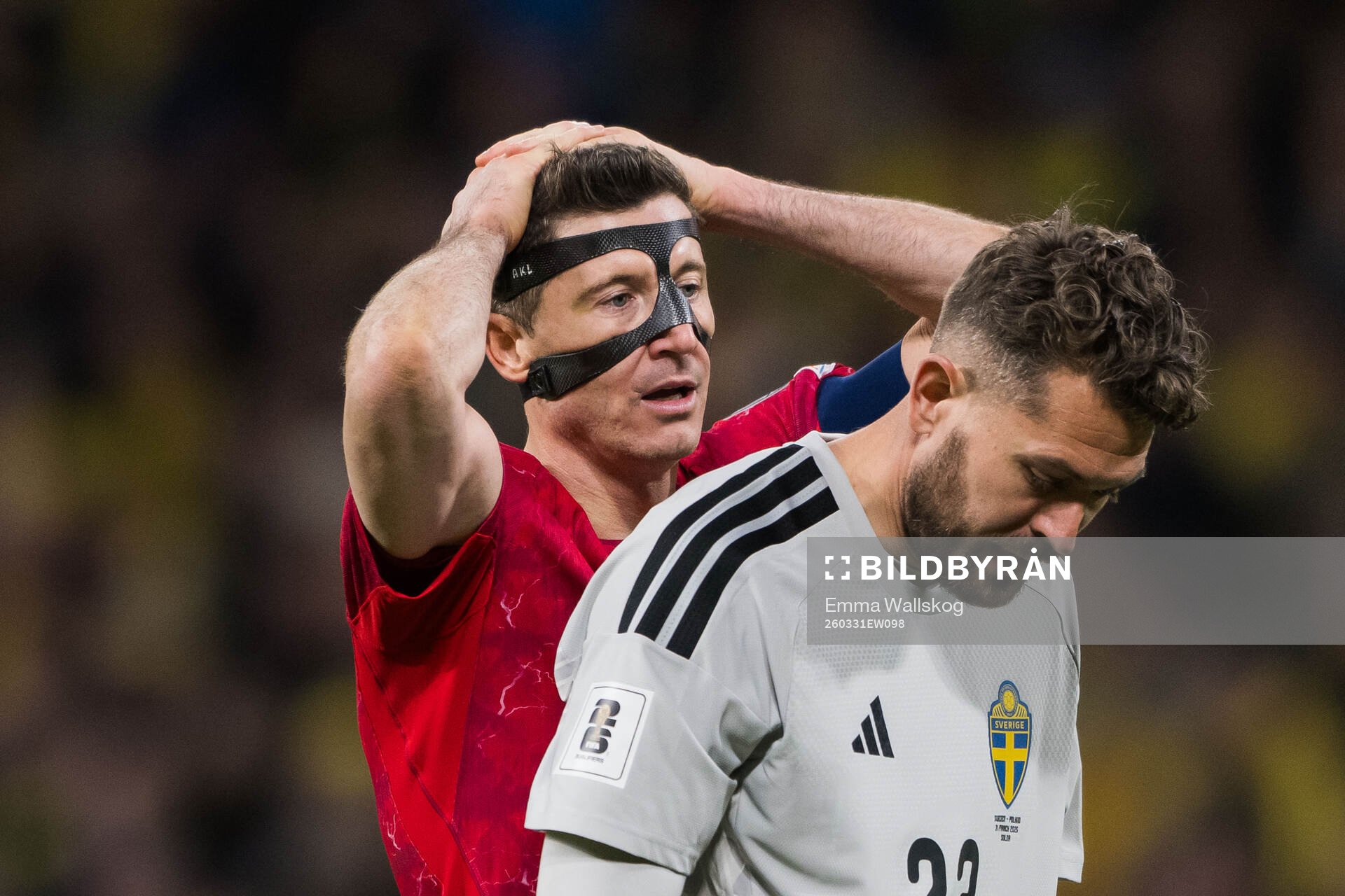 Robert Lewandowski of Poland and goalkeeper Kristoffer