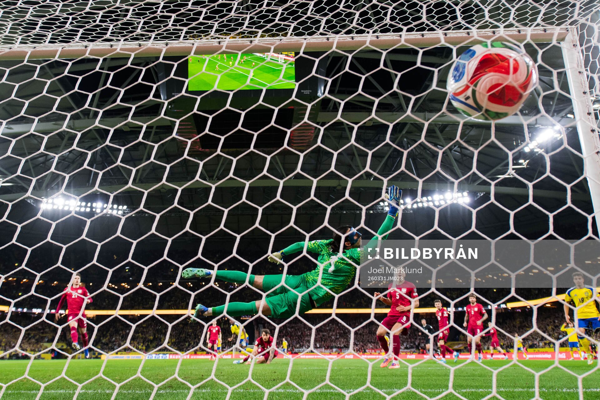 Anthony Elanga of Sweden scores the 1-0 goal against