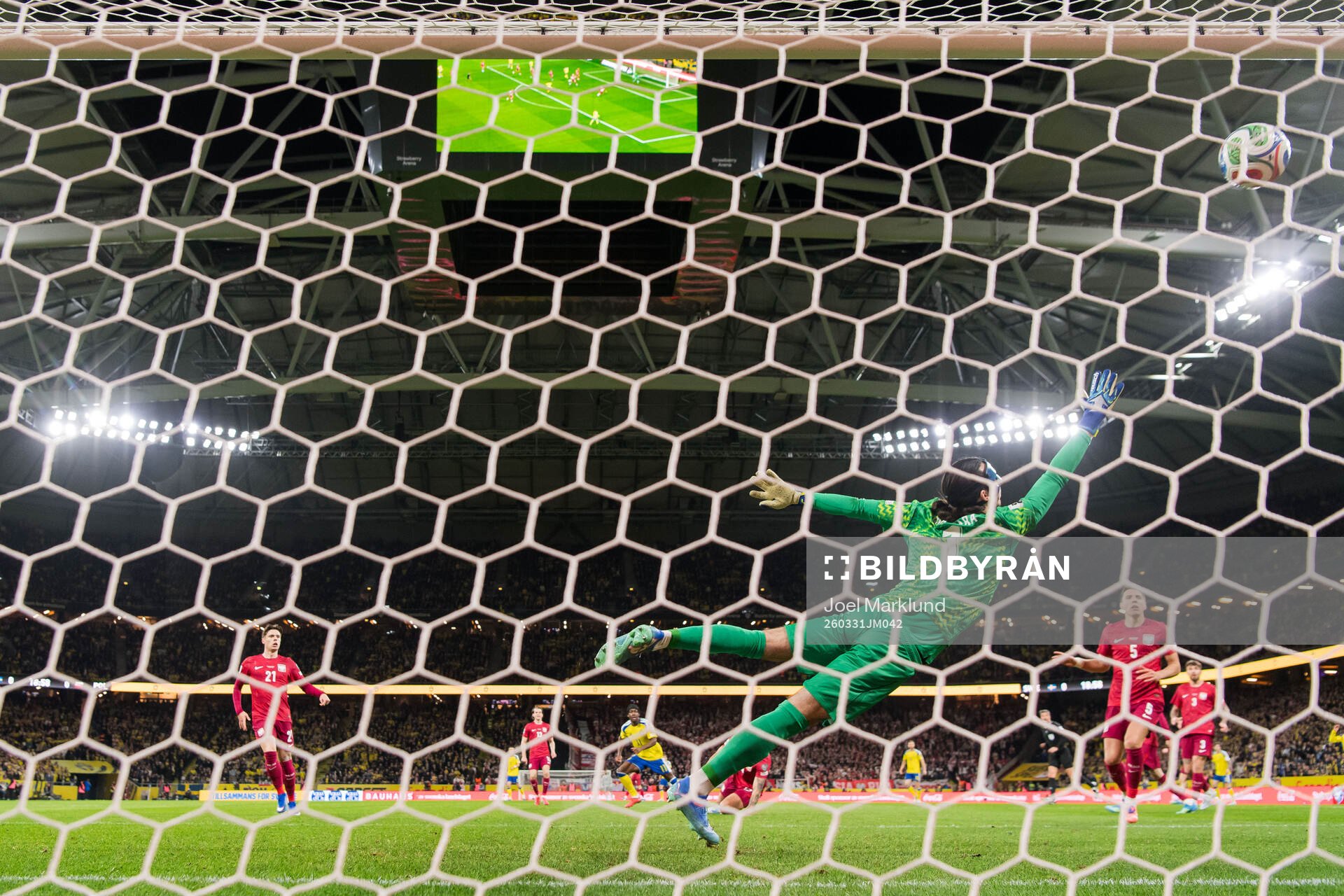 Anthony Elanga of Sweden scores the 1-0 goal against