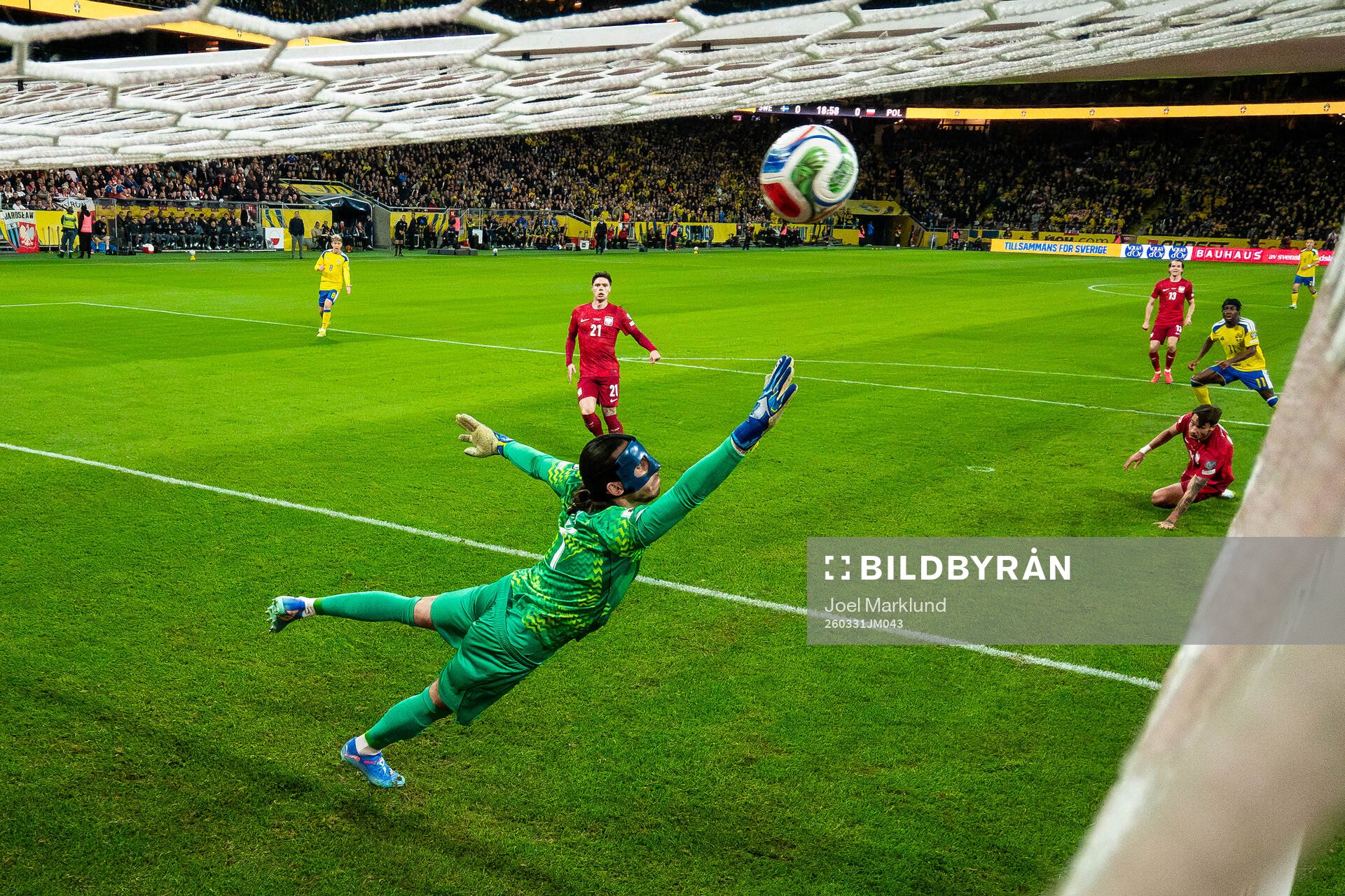 Anthony Elanga of Sweden scores the 1-0 goal behind