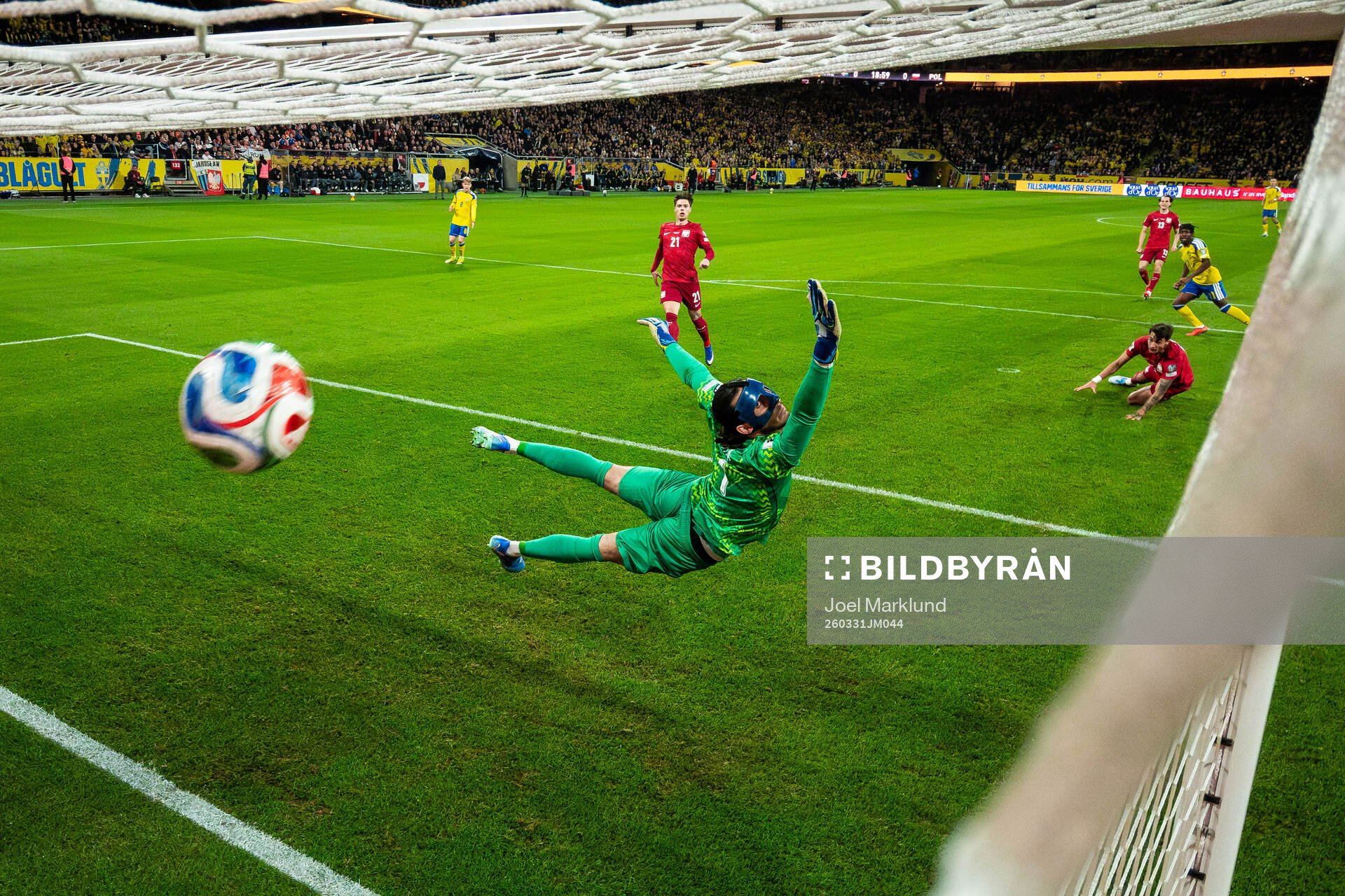 Anthony Elanga of Sweden scores the 1-0 goal behind