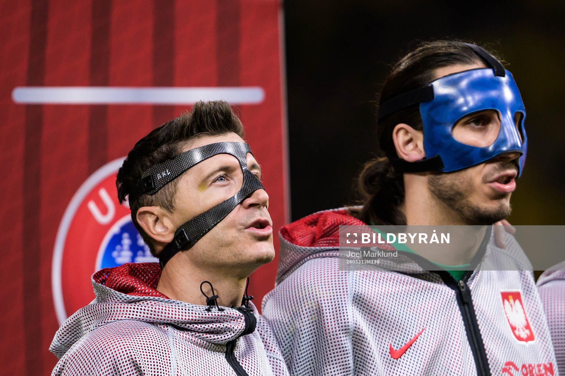 Robert Lewandowski and goalkeeper Kamil Grabara of Poland