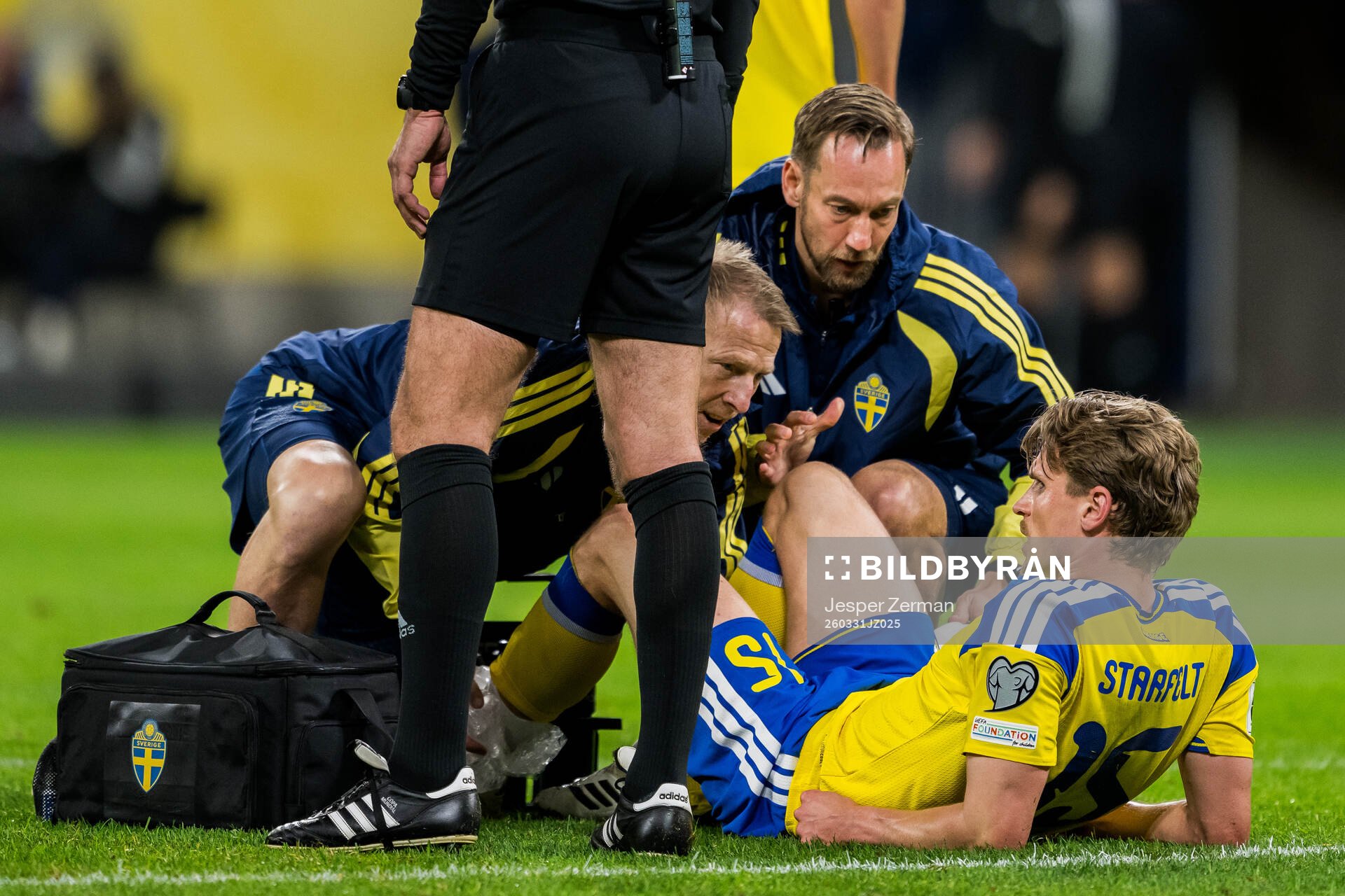 Carl Starfelt of Sweden receives medical attention