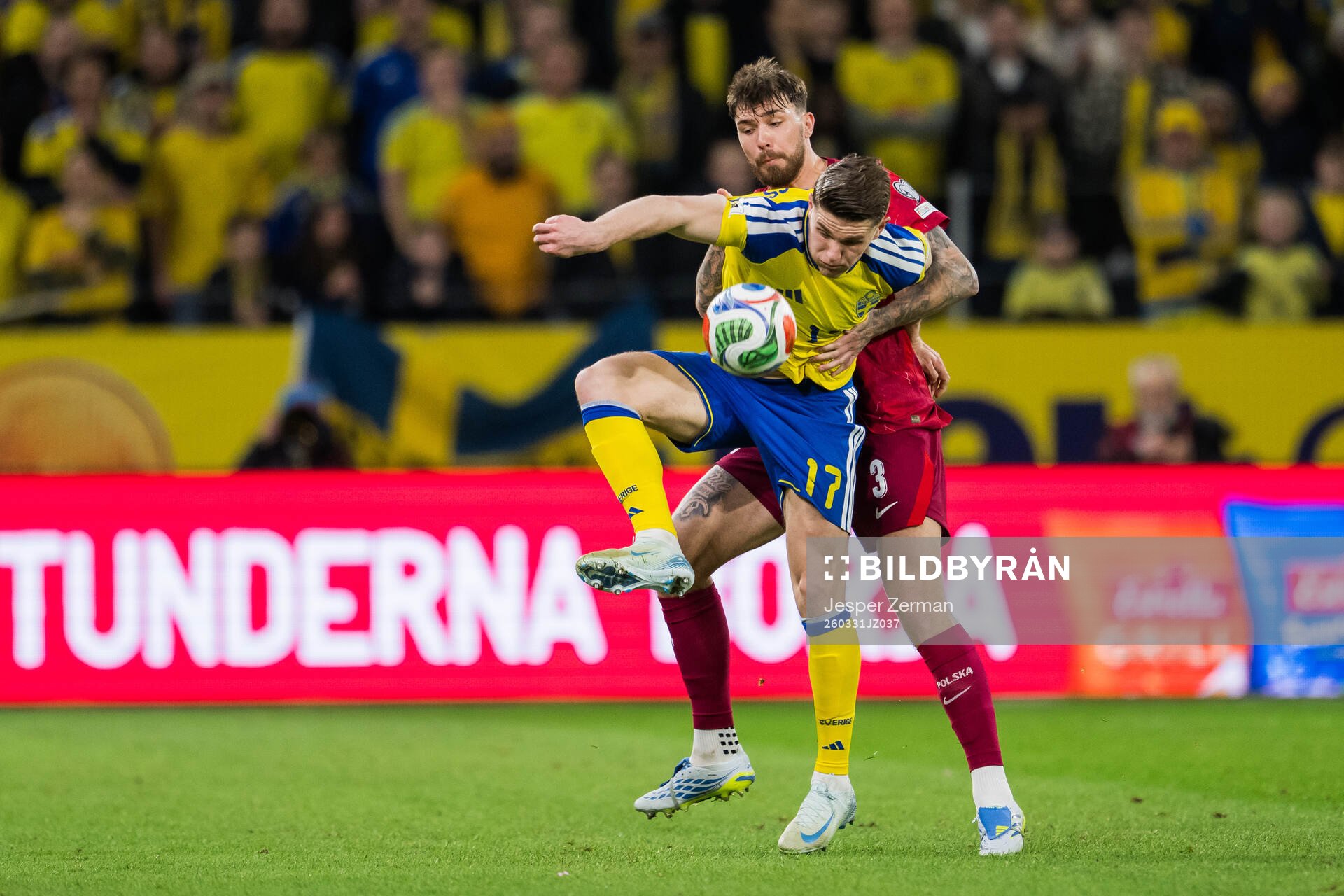 Viktor Gyökeres of Sweden and Przemyslaw Wisniewski of
