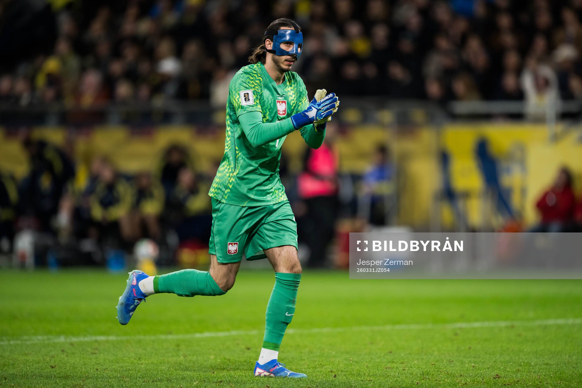 Goalkeeper Kamil Grabara of Poland celebrates