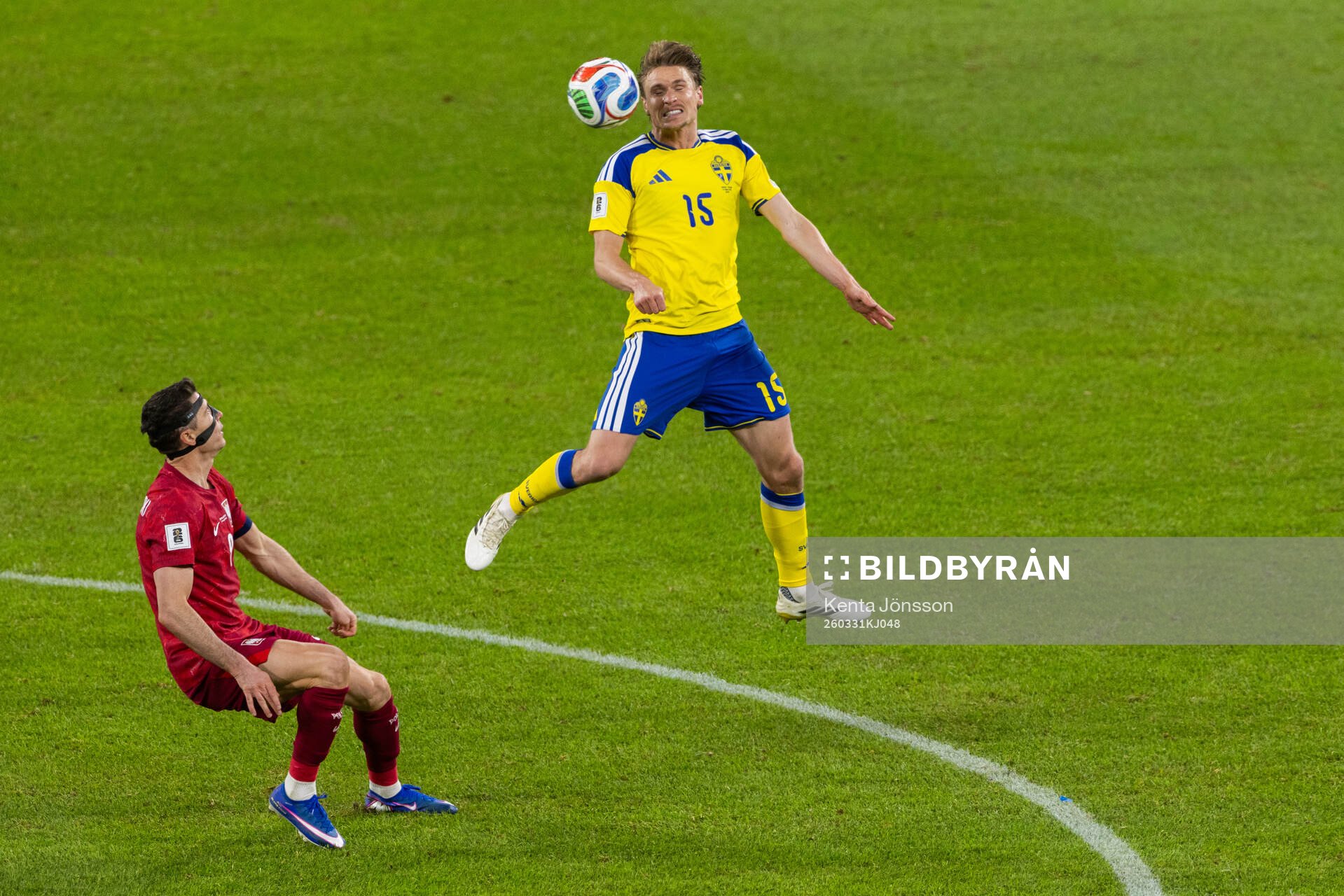 Carl Starfelt of Sweden and Robert Lewandowski of Poland