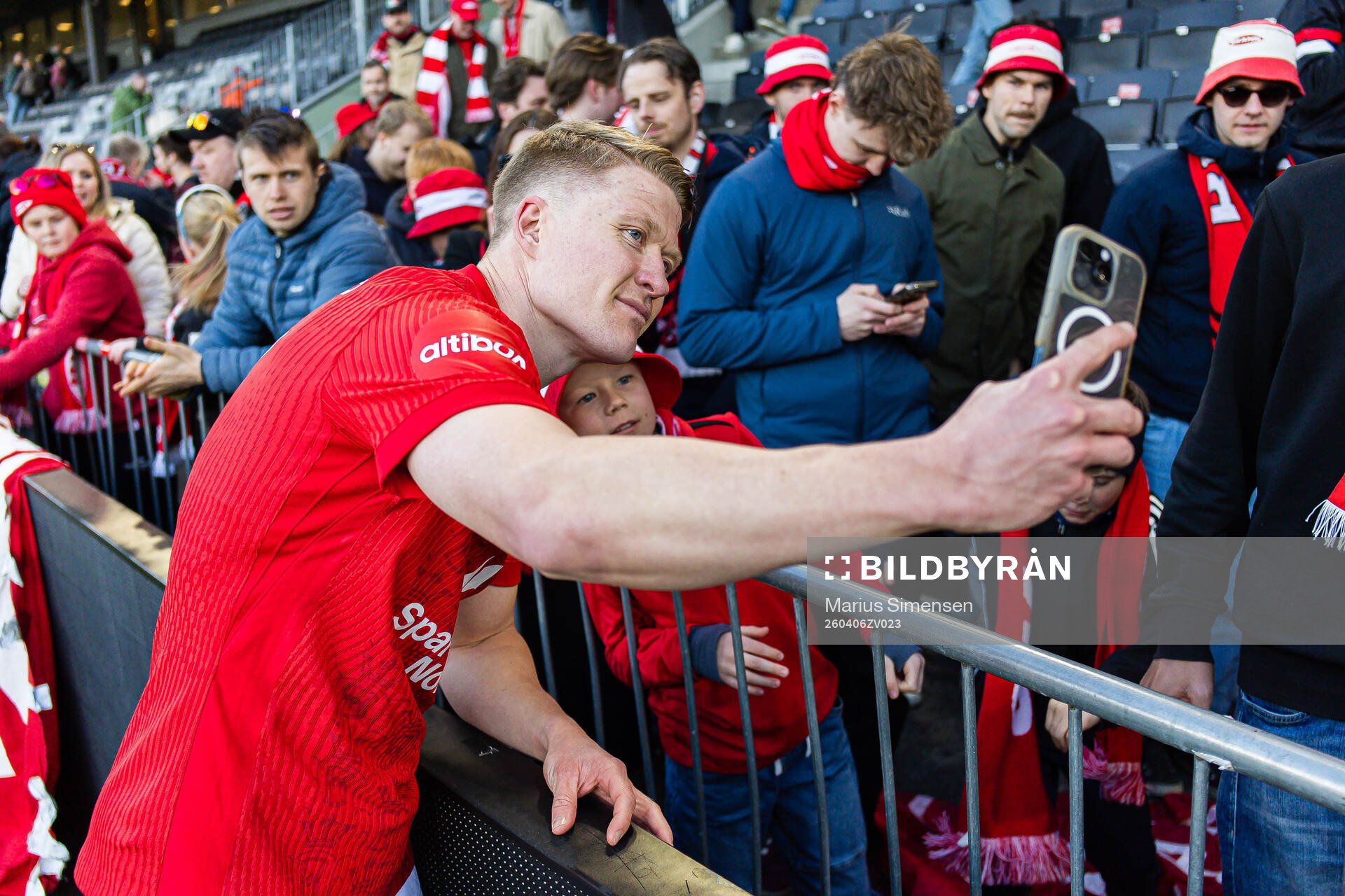 Kristian Eriksen of Brann takes a selfie with a fan