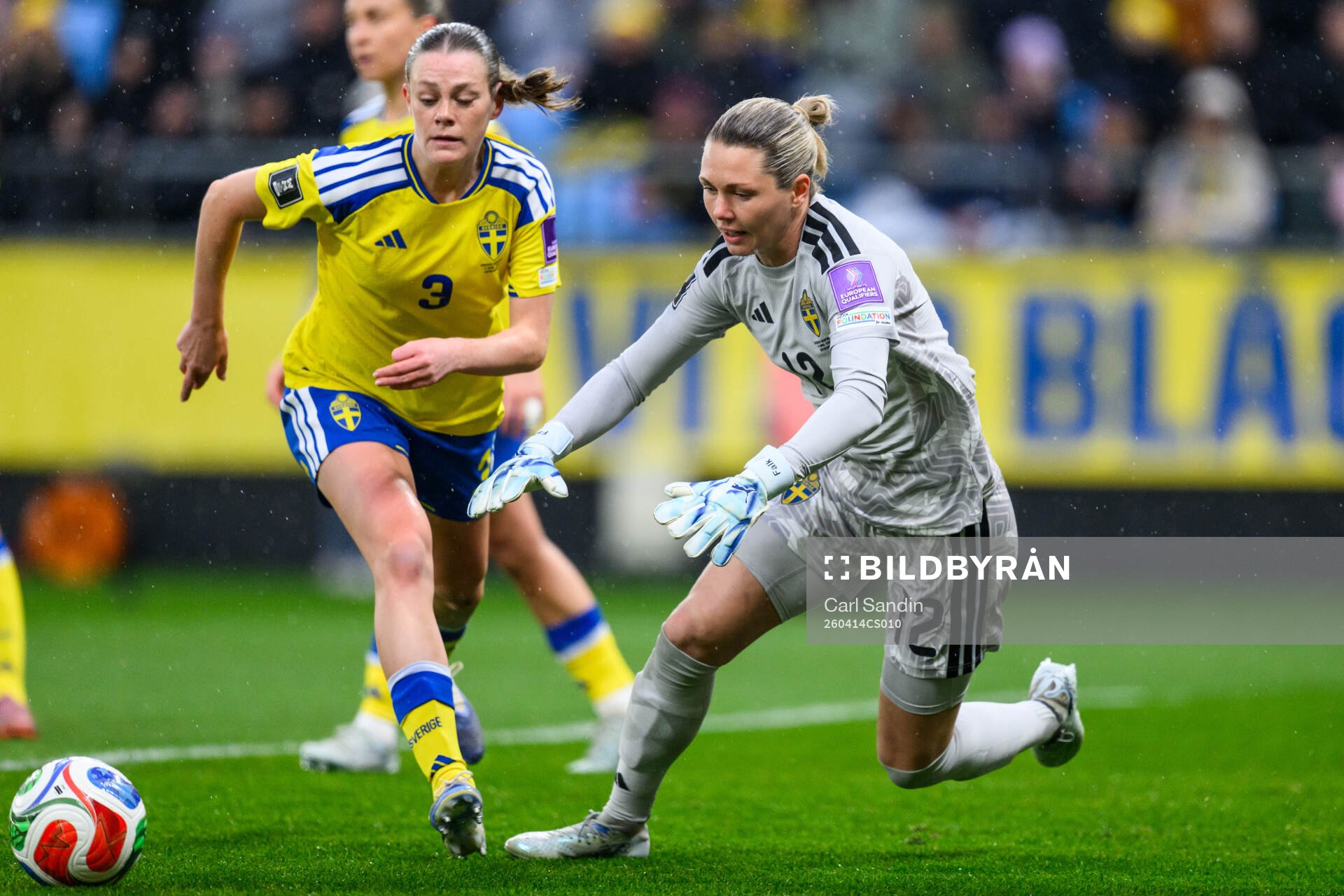 Sofia Reidy and goalkeeper Jennifer Falk of Sweden
