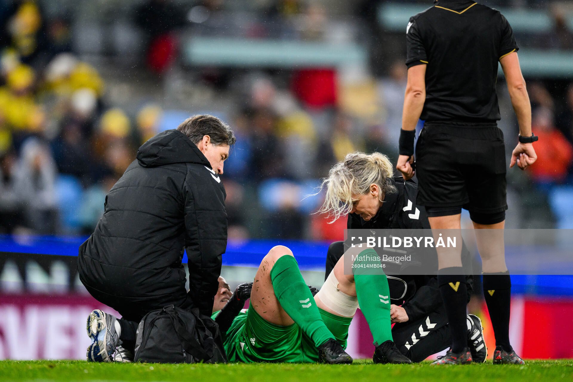 goalkeeper Freja Thisgaard of Denmark recieves medical