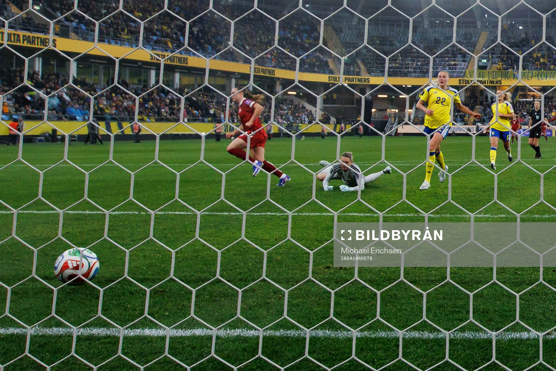 Janni Thomsen of Denmark scores 1-2 behind goalkeeper
