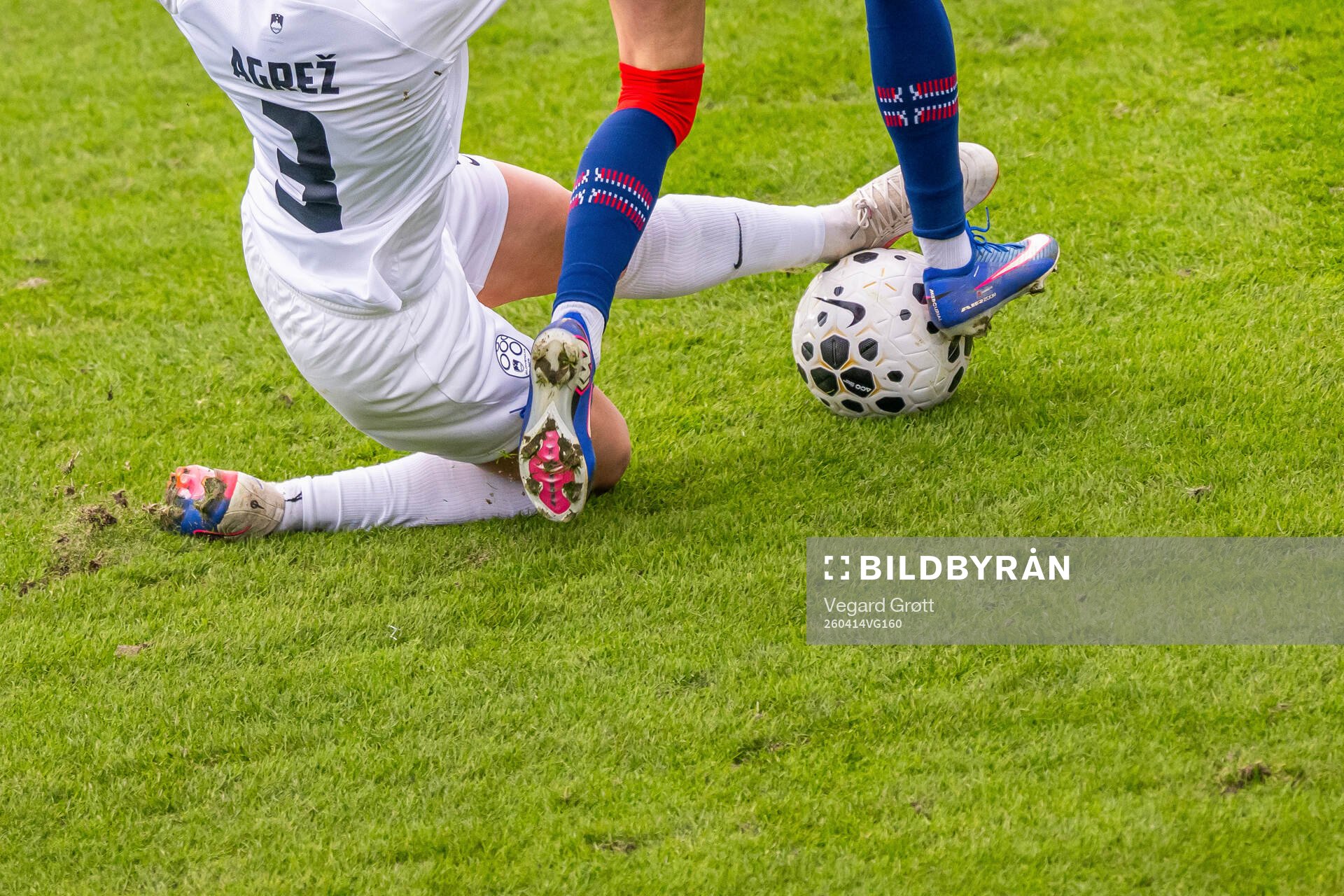 Sara Agrež of Slovenia with a tackle