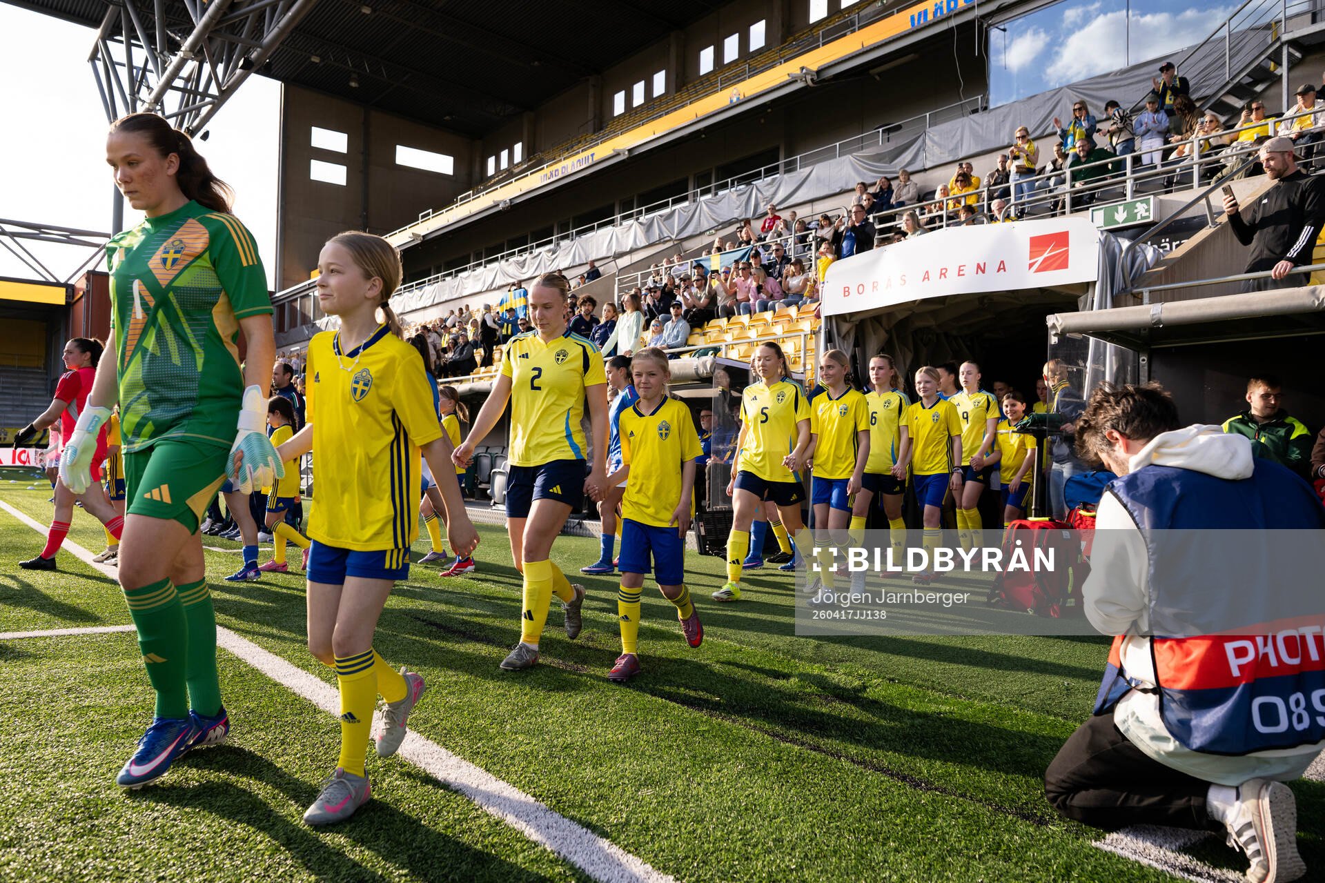 The players walk out onto the pitch