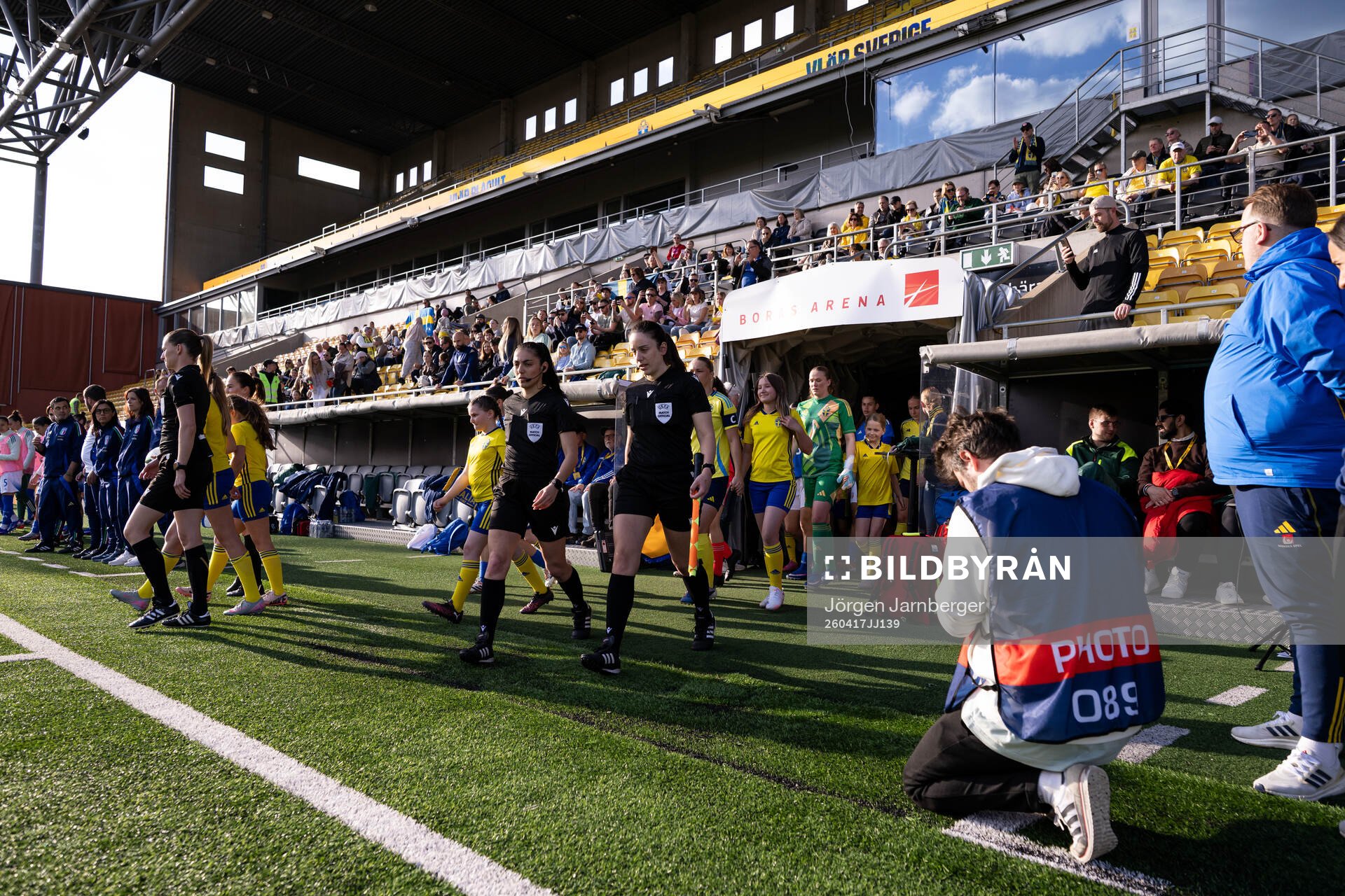 The players walk out onto the pitch