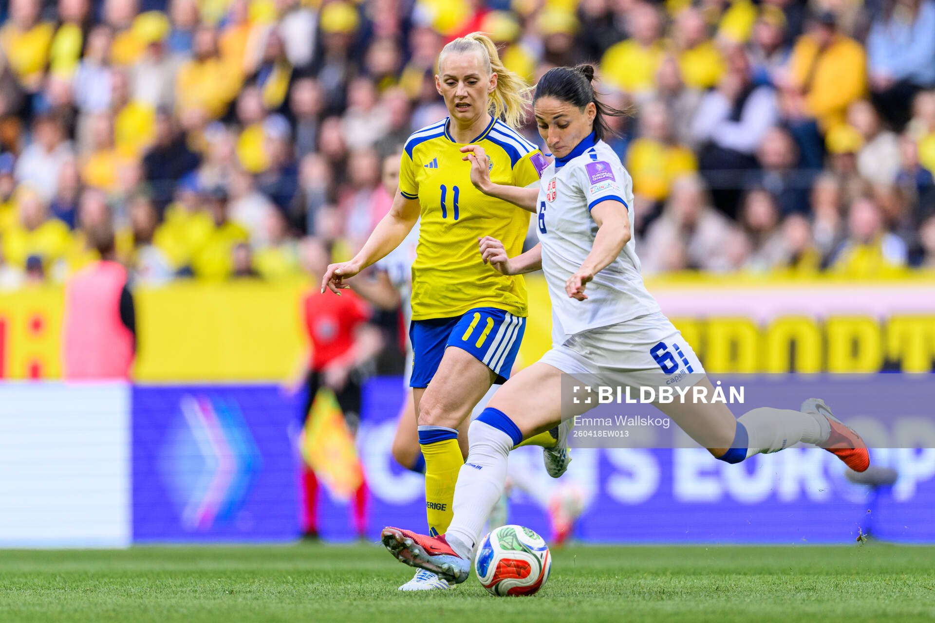 Stina Blackstenius of Sweden and Nevena Damjanovic of Serbia