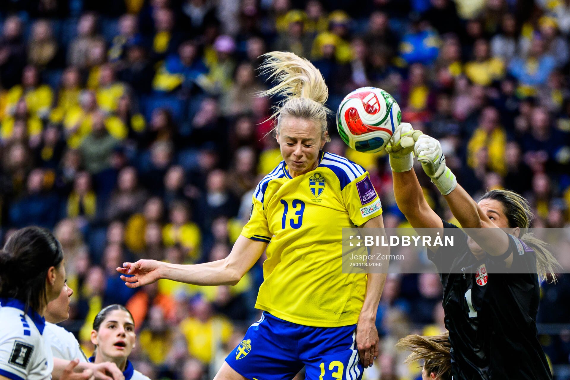Amanda Ilestedt of Sweden and goalkeeper Milica Kostic of