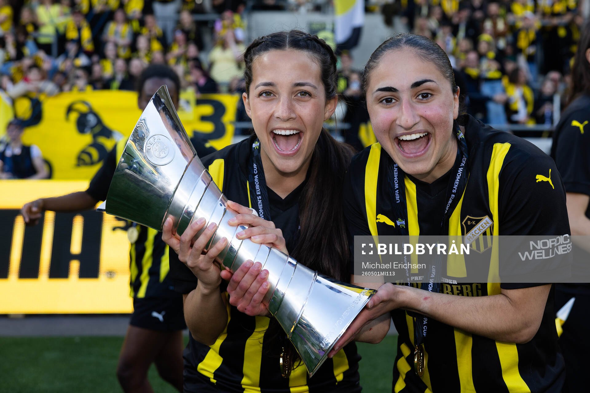 Delaney Matriano and Nesrin Akgun celebrate with the trophy