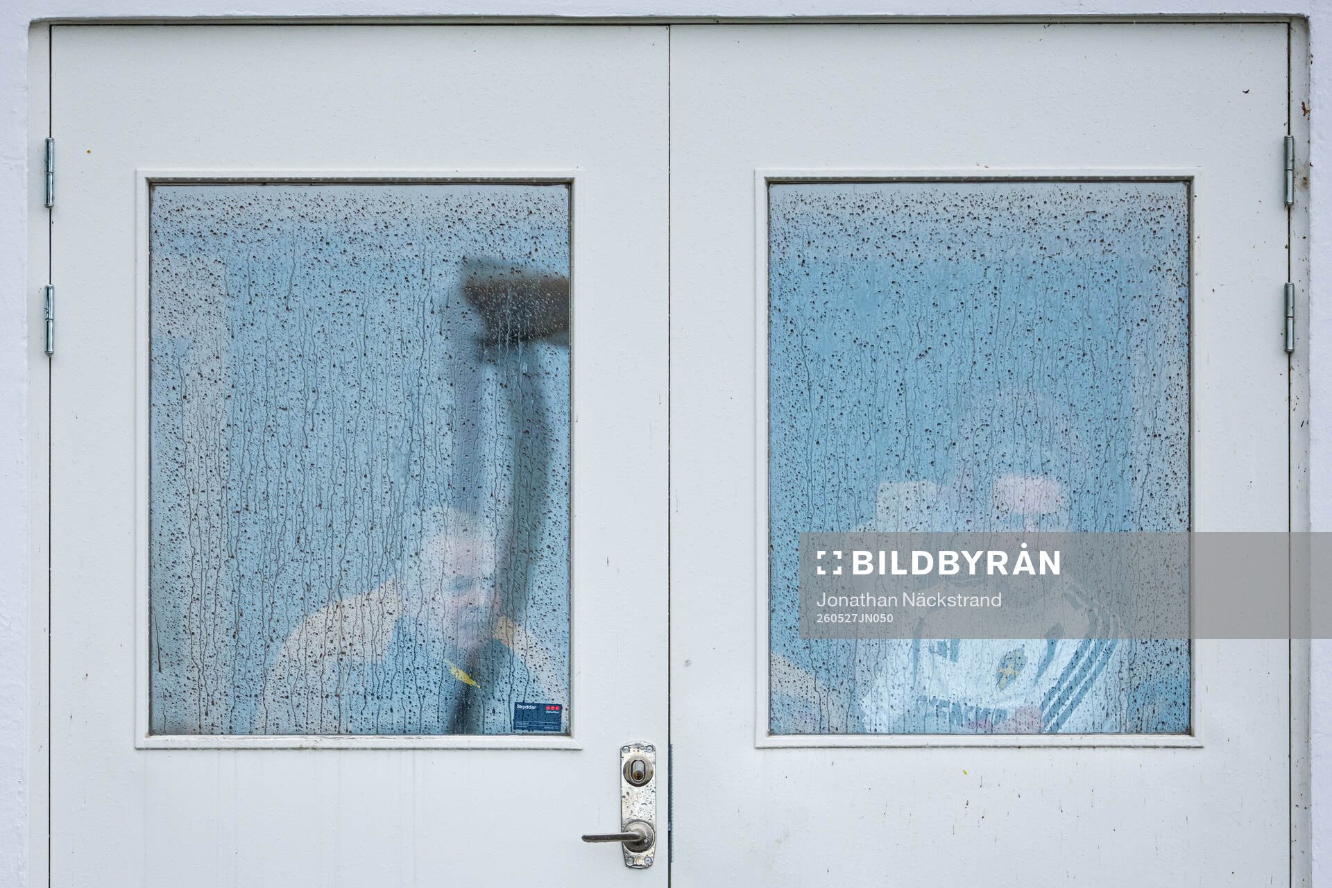 Members of the Swedish national football team take cover