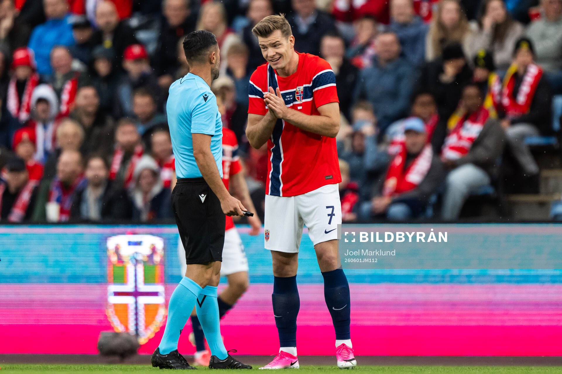 Referee Balázs Berke and Alexander Sørloth of Norway