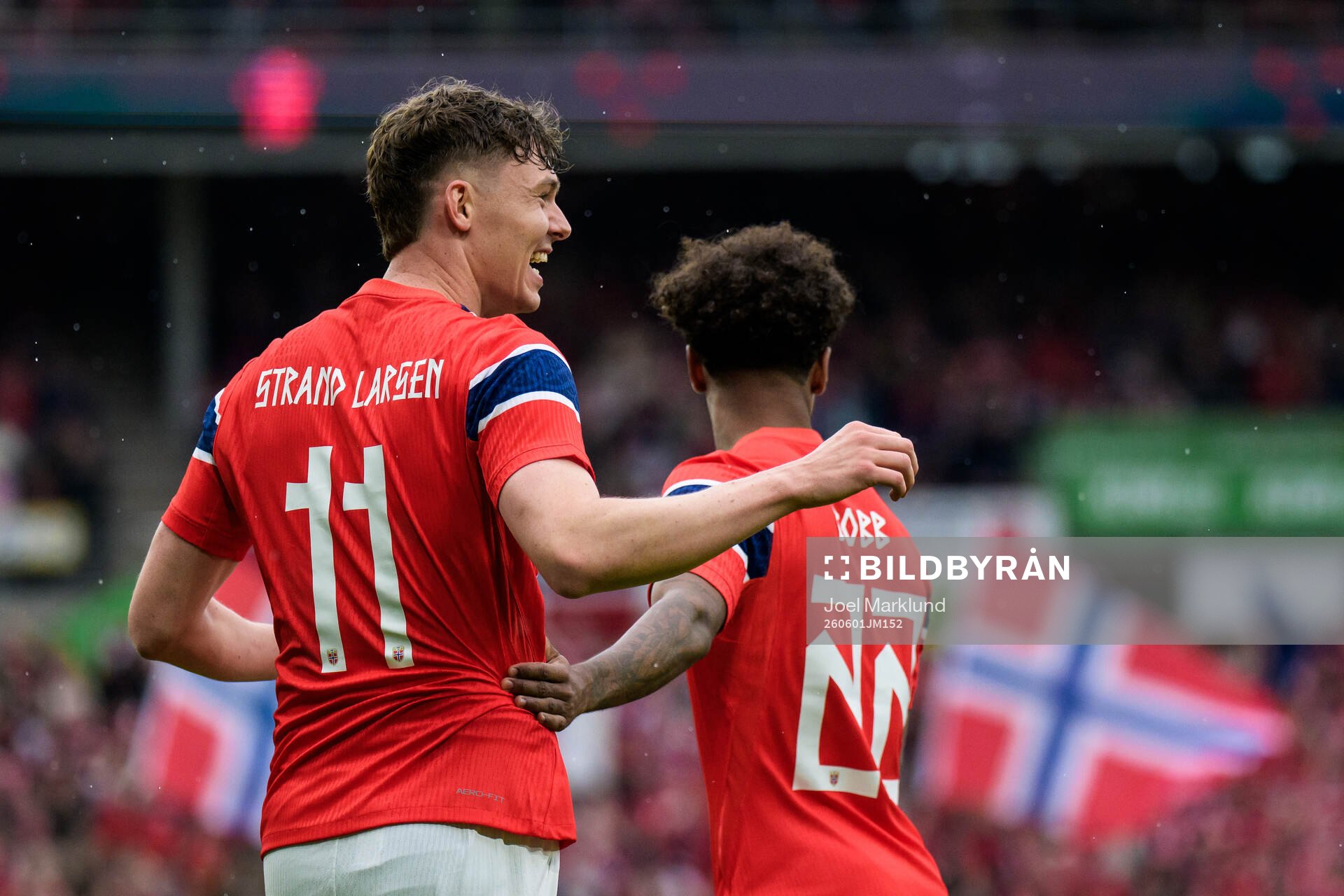 Jørgen Strand Larsen of Norway celebrates with Oscar Bobb