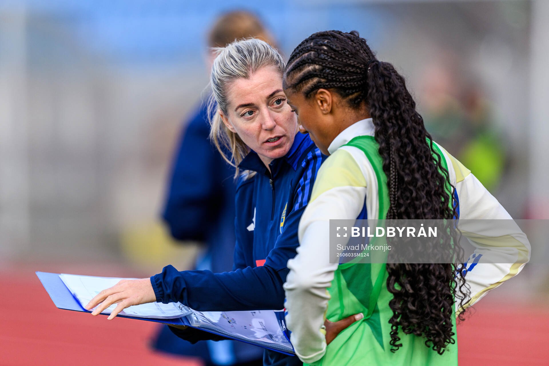 Assistant coach Linda Sembrandt and Cassandra Bogere of