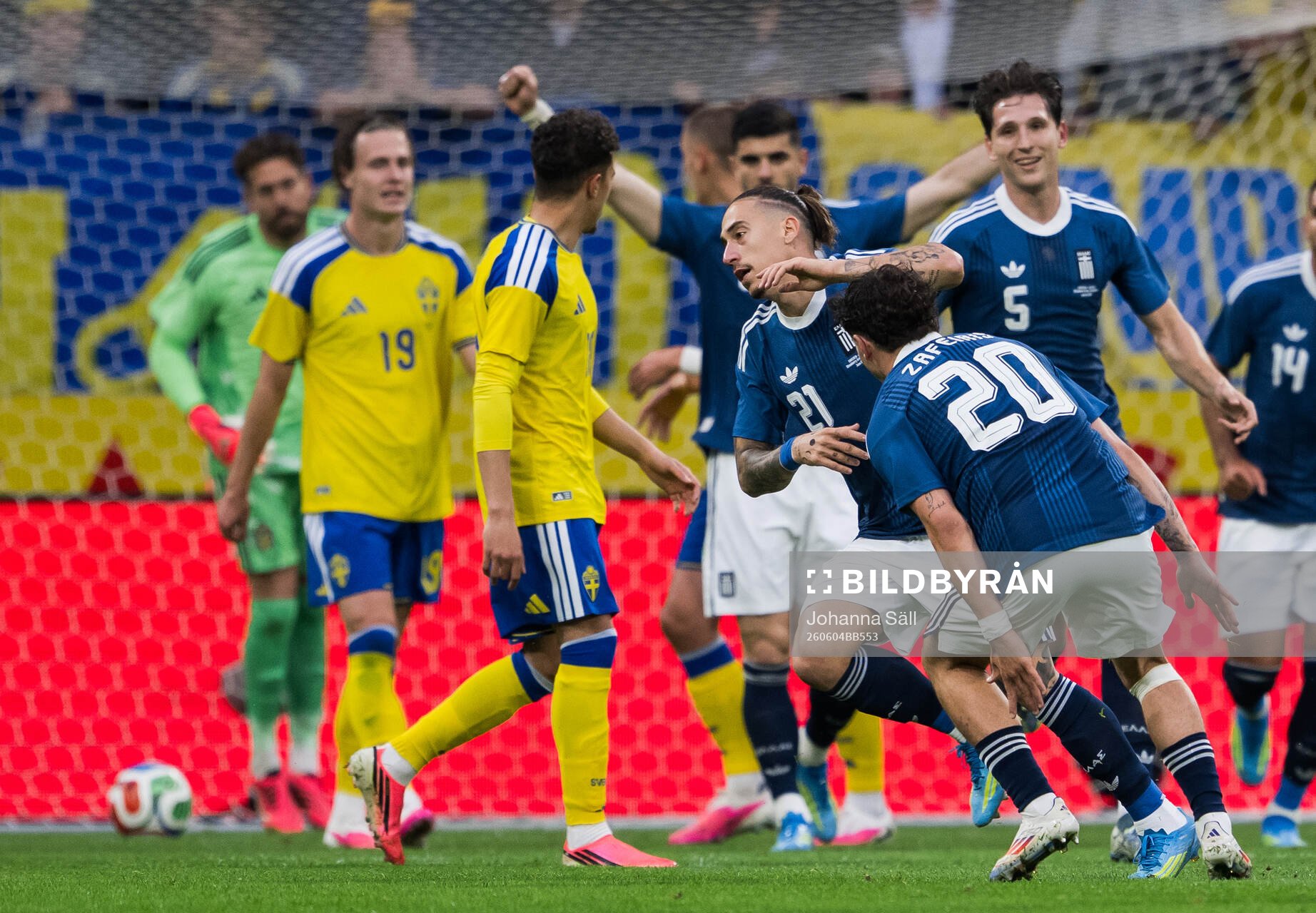 Kostas Tsimikas of Greece celebrates