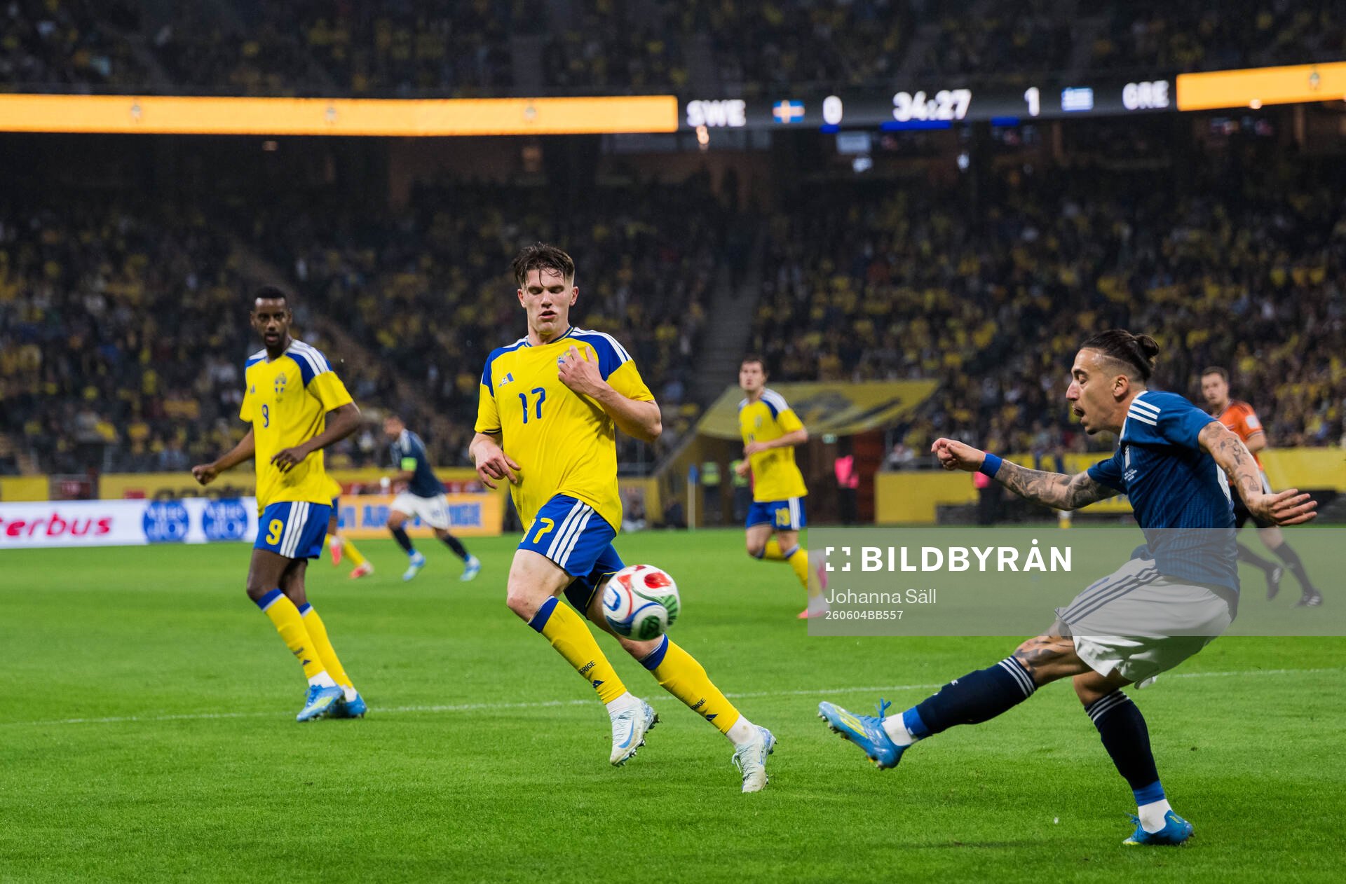 Viktor Gyökeres of Sweden and Kostas Tsimikas of Greece