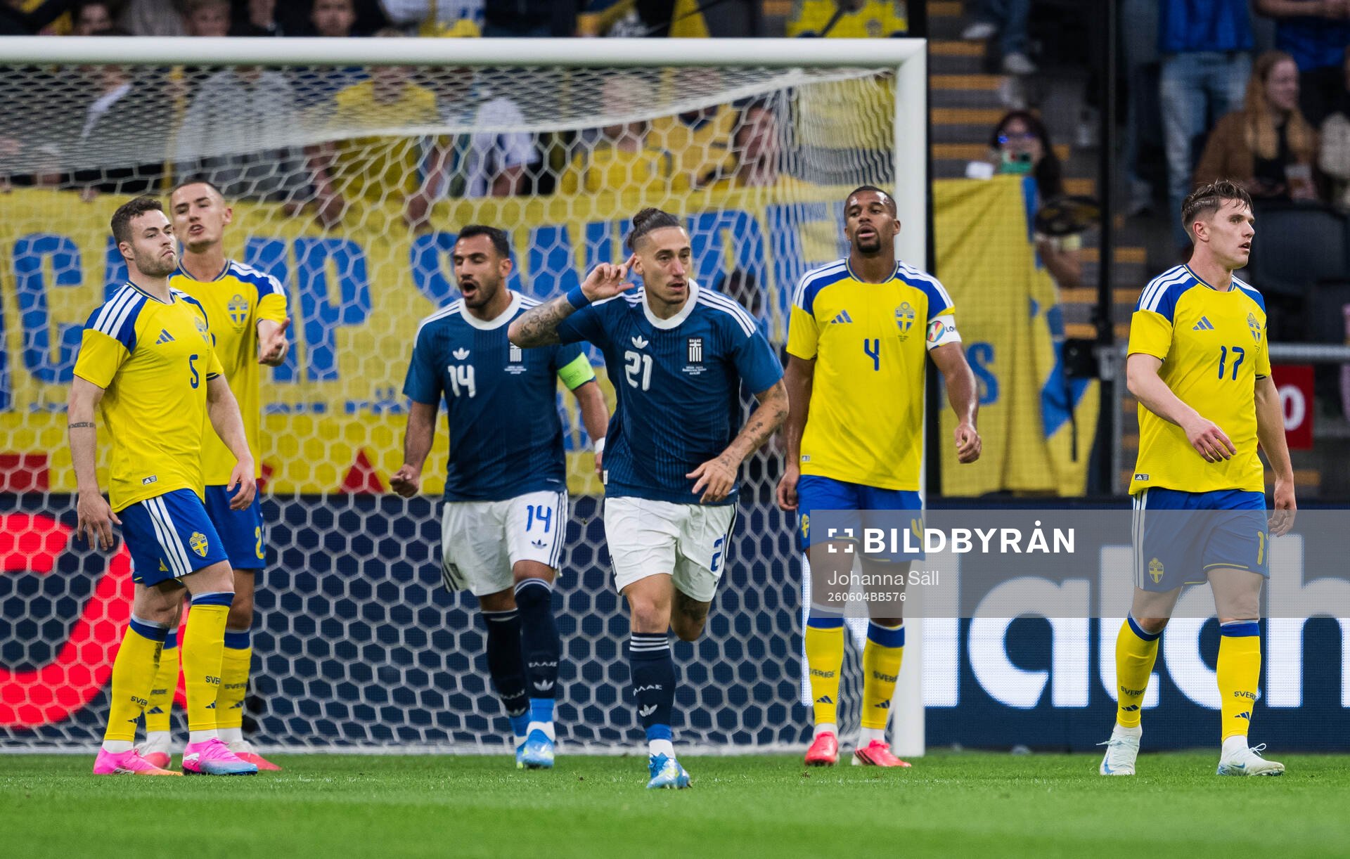 Kostas Tsimikas of Greece celebrates