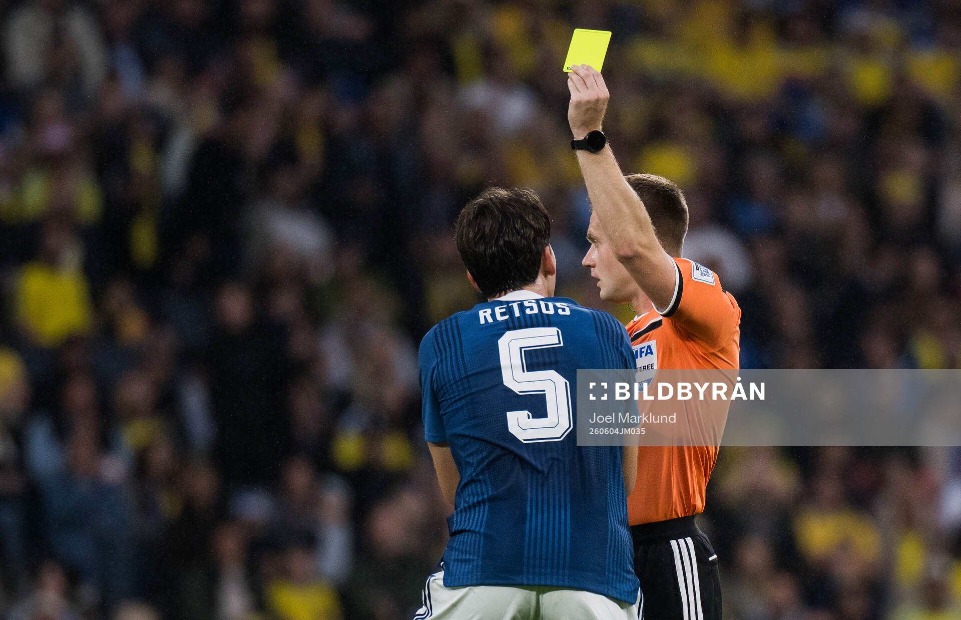 Panagiotis Retsos of Greece receives a yellow card from