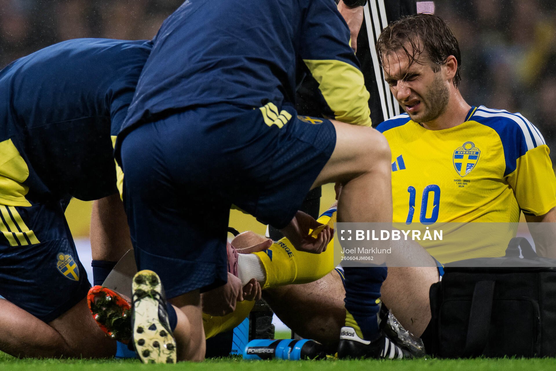 Benjamin Nygren of Sweden receives medical attention