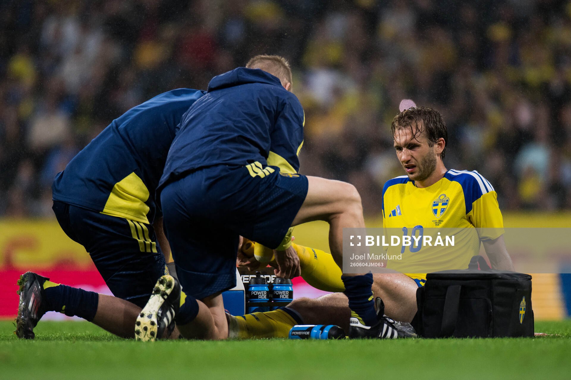 Benjamin Nygren of Sweden receives medical attention