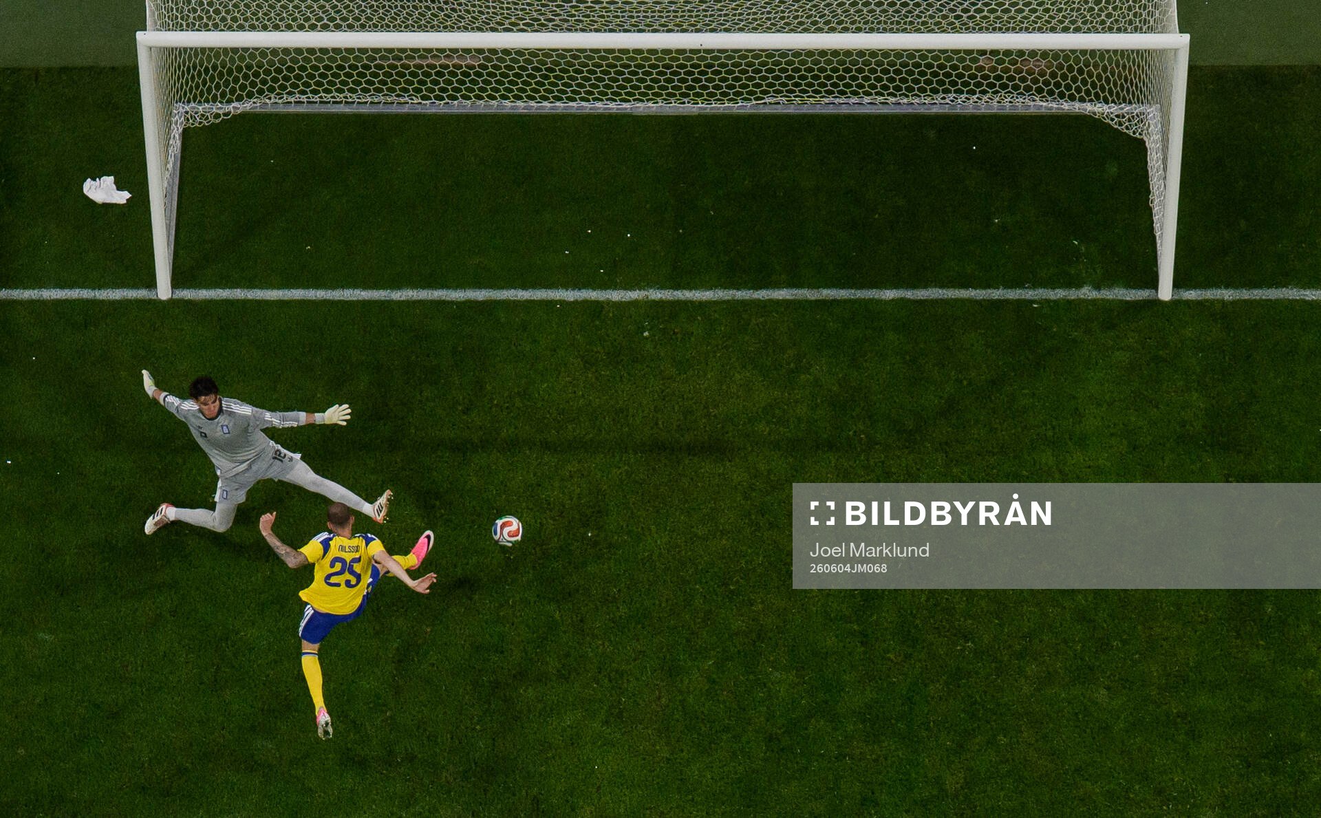 Gustaf Nilsson of Sweden scores 2-1 past goalkeeper Kostas
