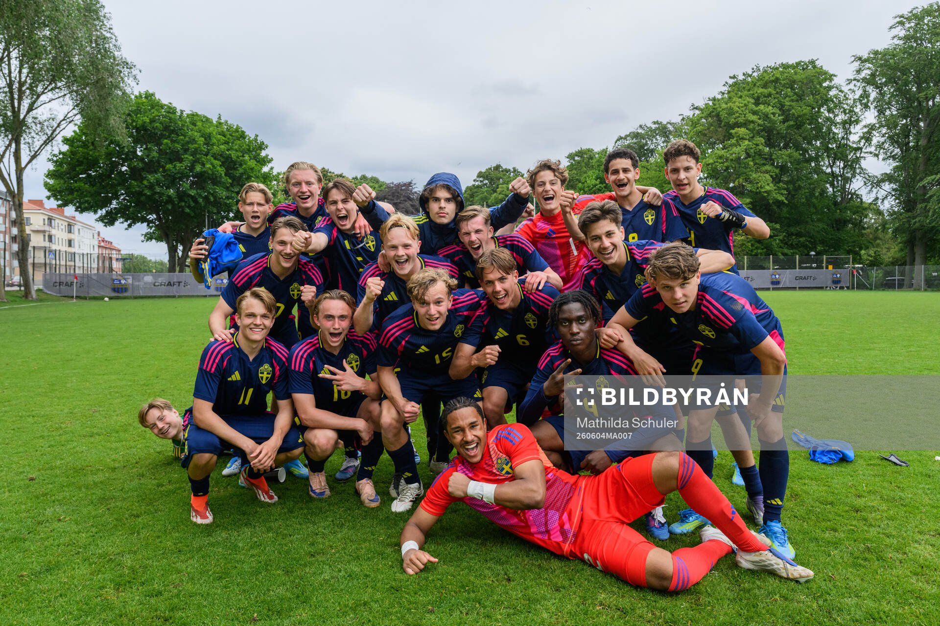 Players of the blue team celebrate winning