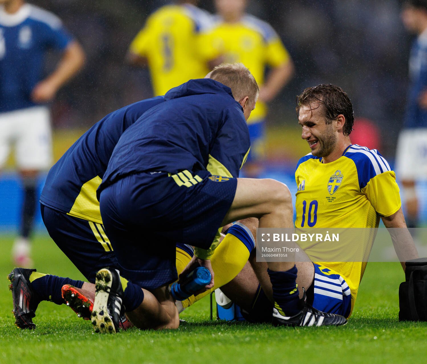 Benjamin Nygren of Sweden receives medical attention
