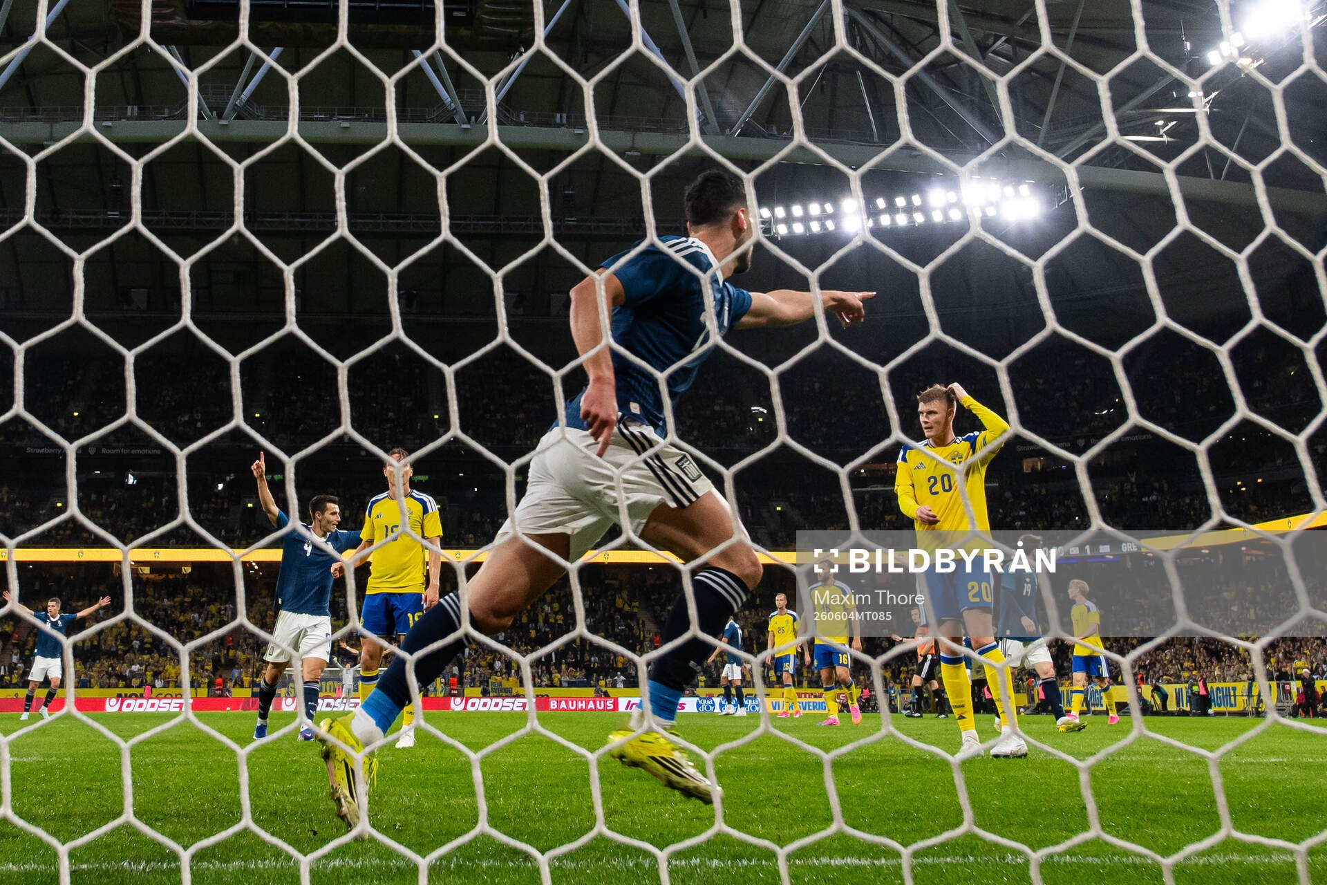 Carl Starfelt and Eric Smith of Sweden look dejected as