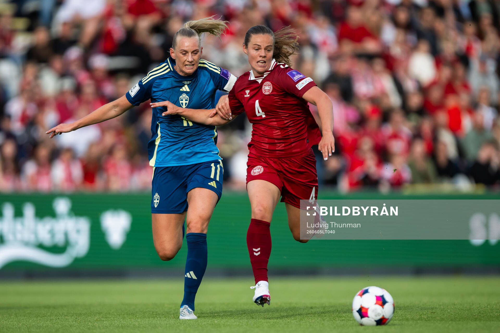 Stina Blackstenius of Sweden and Emma Skou Færge of Denmark