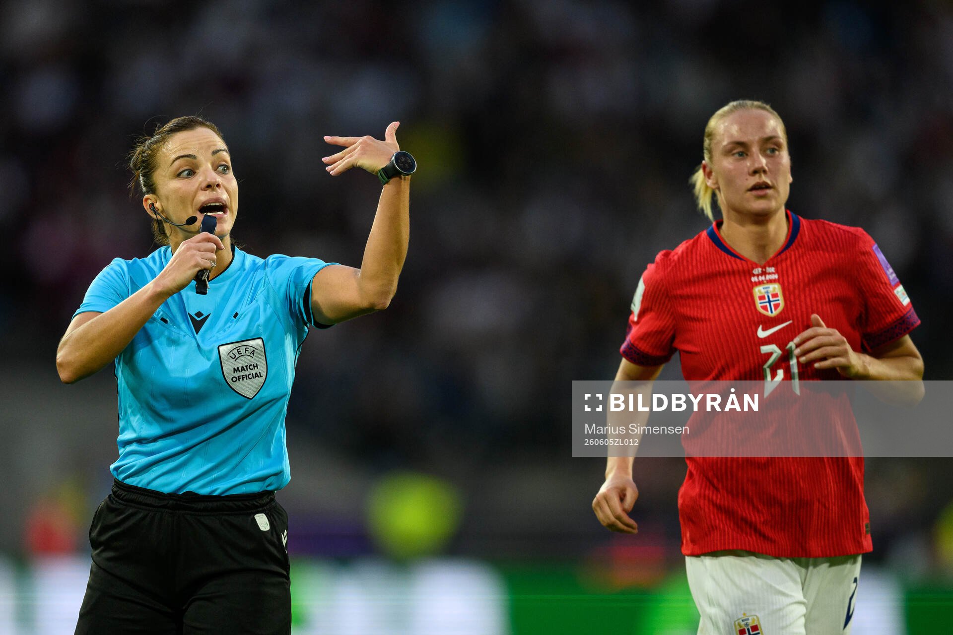Referee Marta Huerta De Aza and Lisa Naalsund of Norway