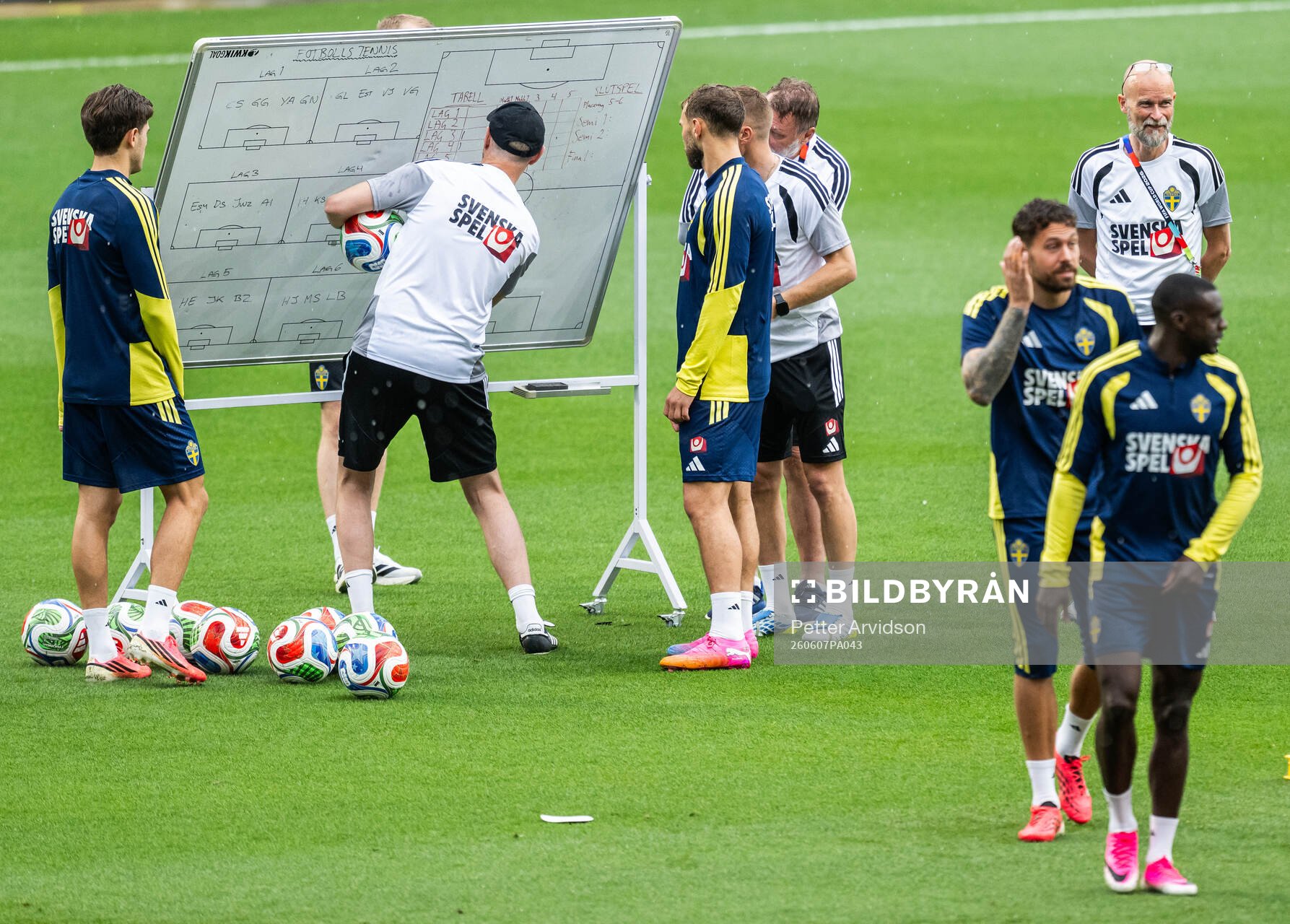 Assistant coach Andreas Georgson instructs players of the