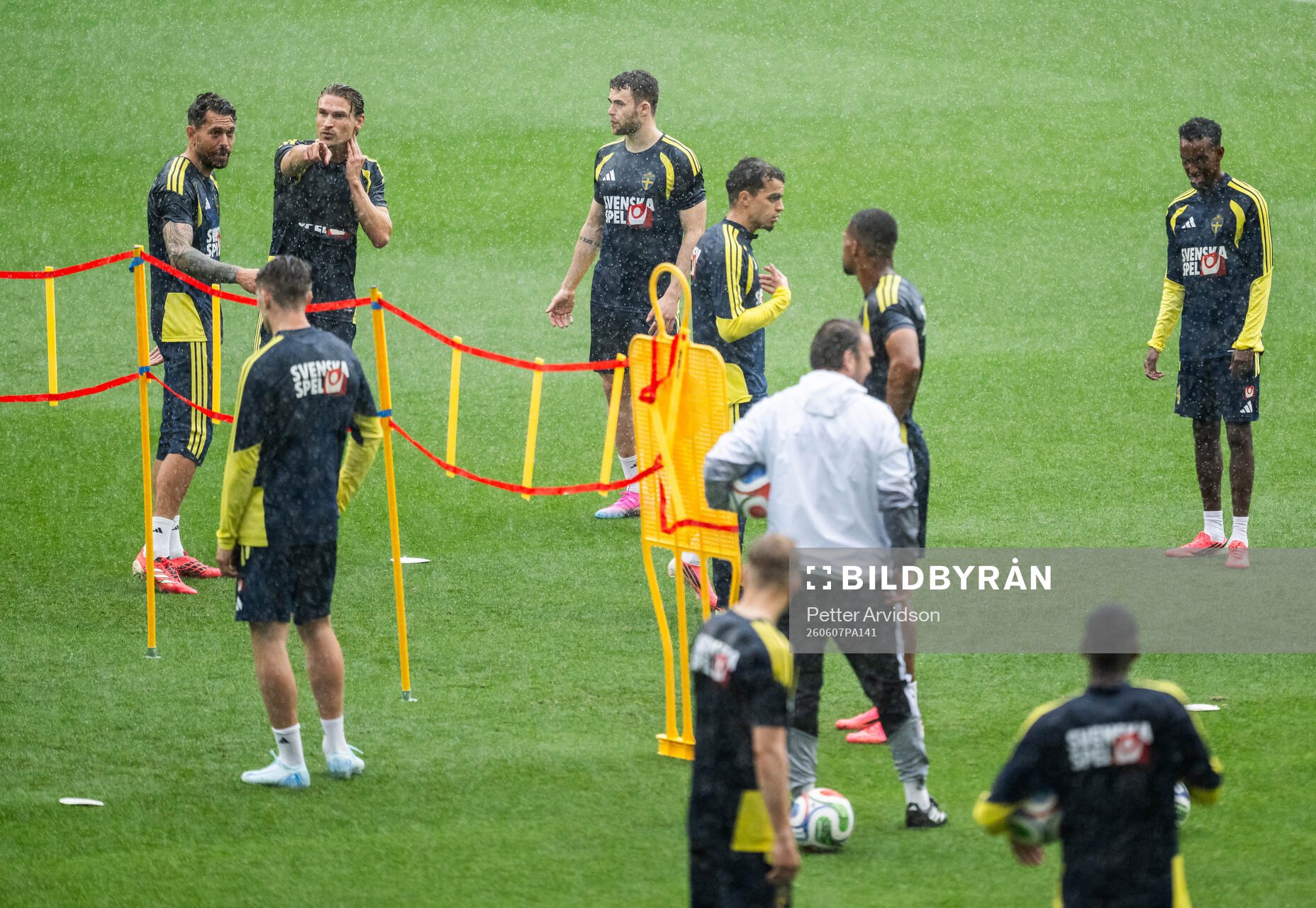 Players of the Swedish national football team in the rain