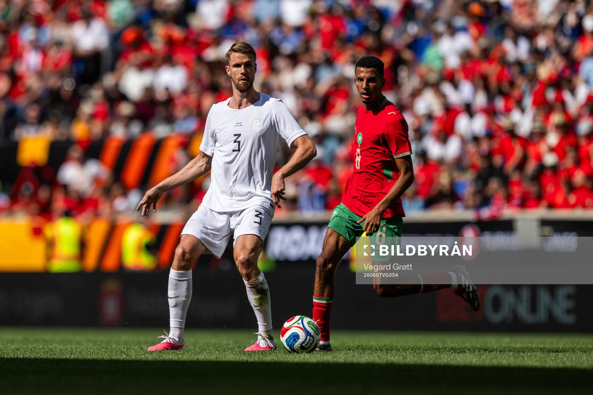 Kristoffer Ajer of Norway and Azzedine Ounahi of Morocco