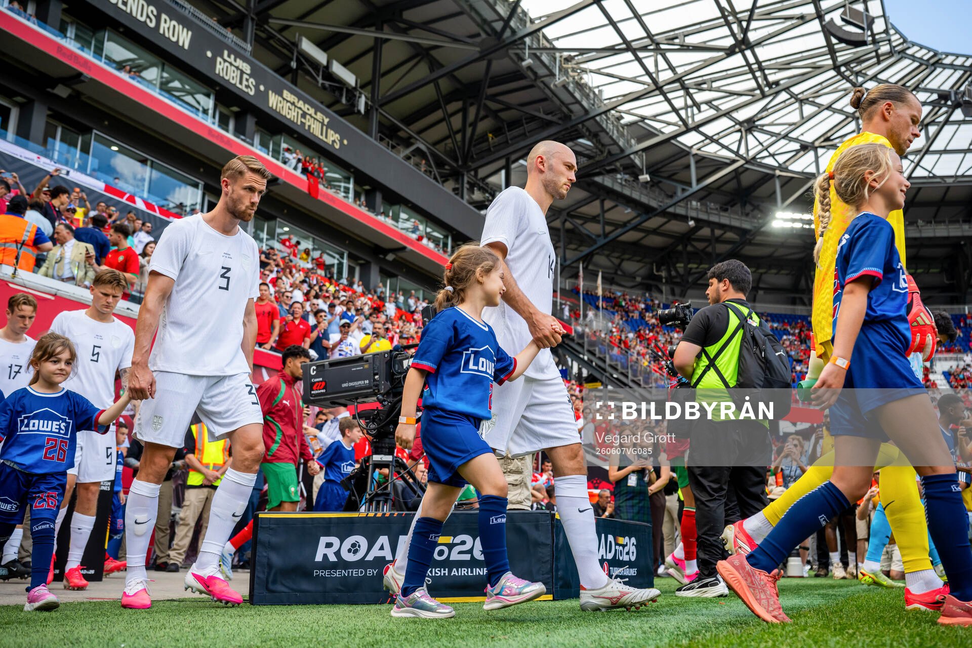 Kristoffer Ajer and Fredrik Aursnes of Norway enter the